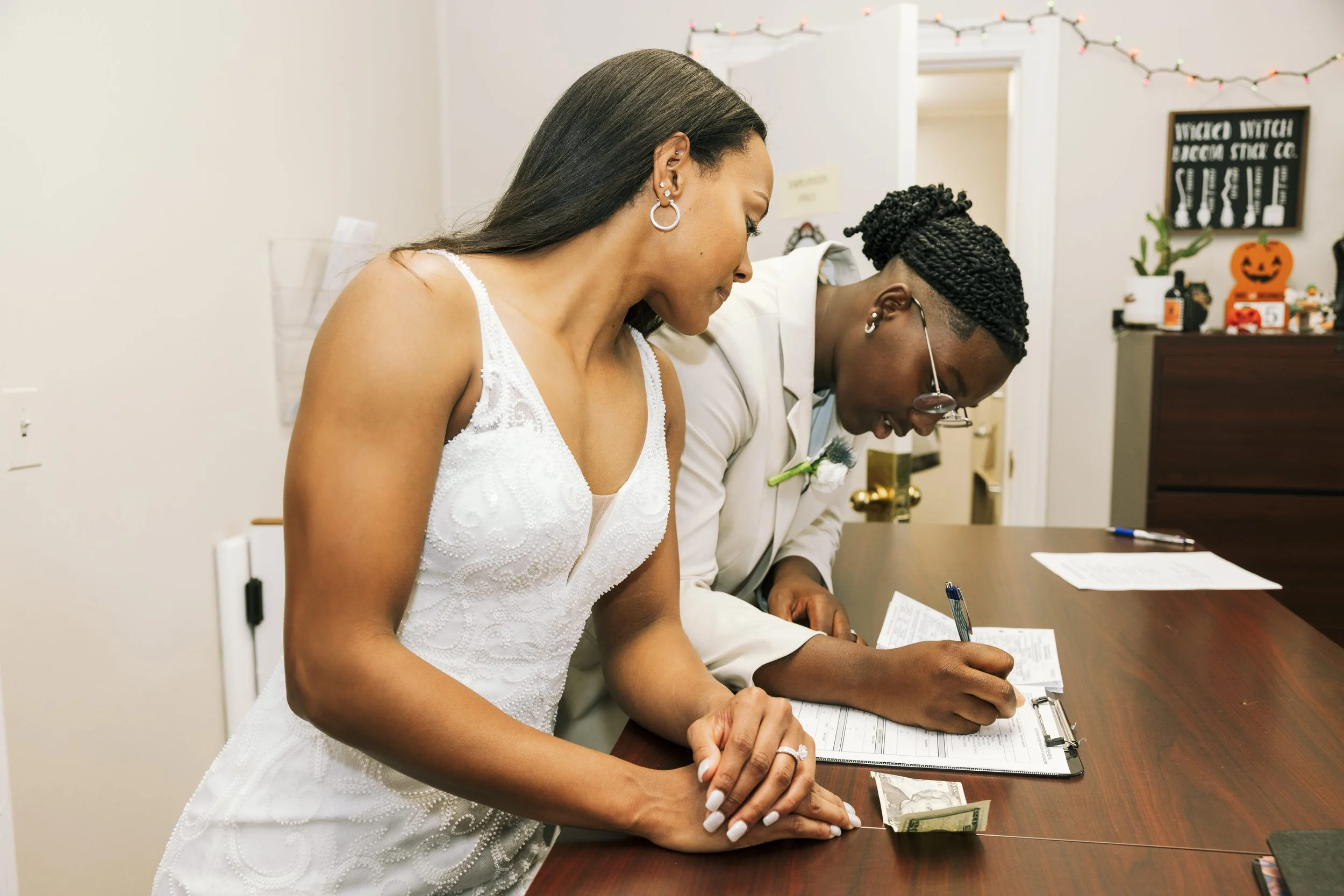 Newly married couple completing paperwork for same-day Certified Marriage Certificate service in Westfield, New Jersey.