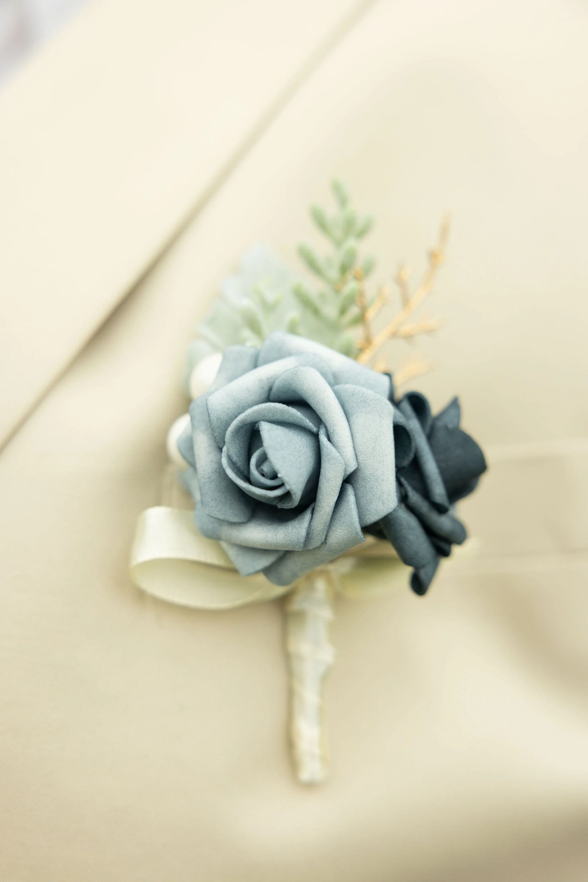 Close-up of boutonniere on suit during a Liberty State Park elopement in New Jersey