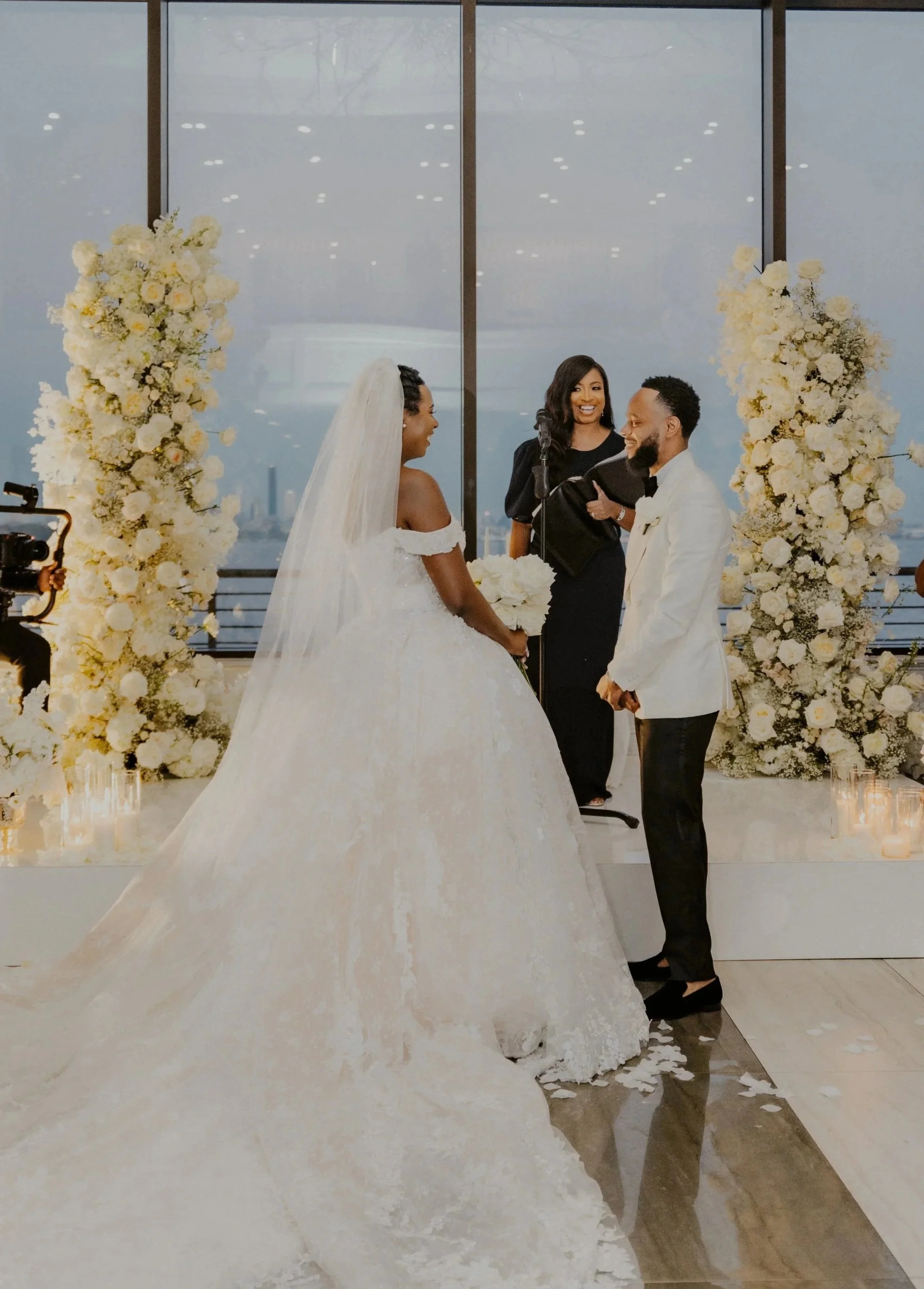 New Jersey wedding officiant speaking with a couple during their ceremony at Hudson House in Jersey City