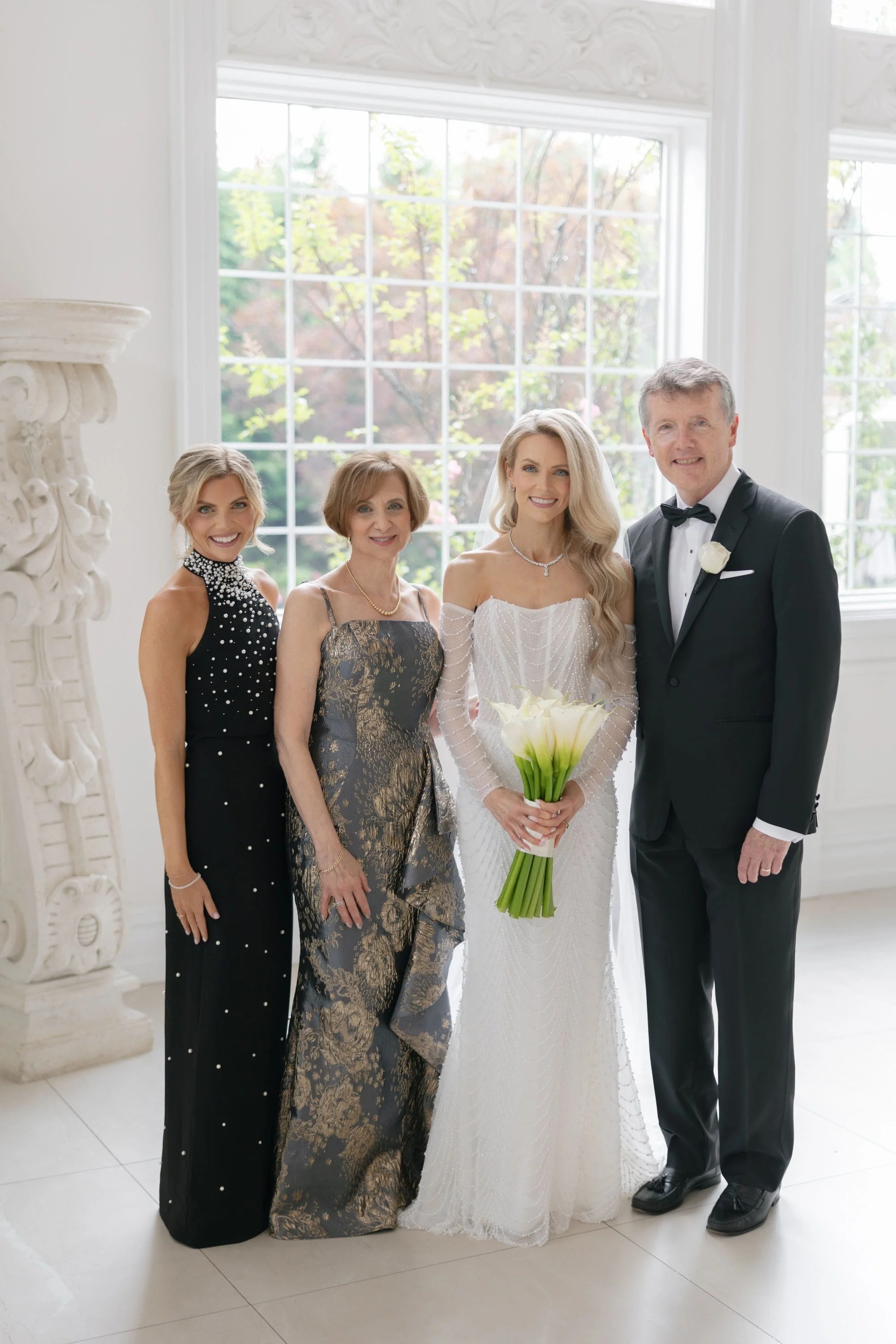 Caroline with her parents and family before her Florentine Gardens wedding ceremony