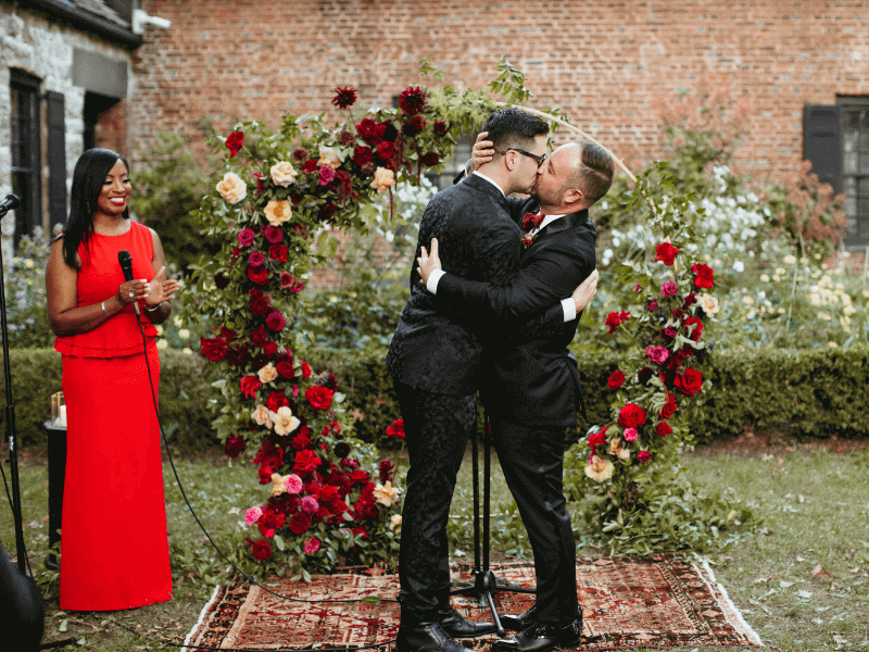 Aretha Gaskin officiates an LGBT wedding at Senate Garage in Kingston, NY, as the couple seals their vows with a magical kiss to celebrate their special day.