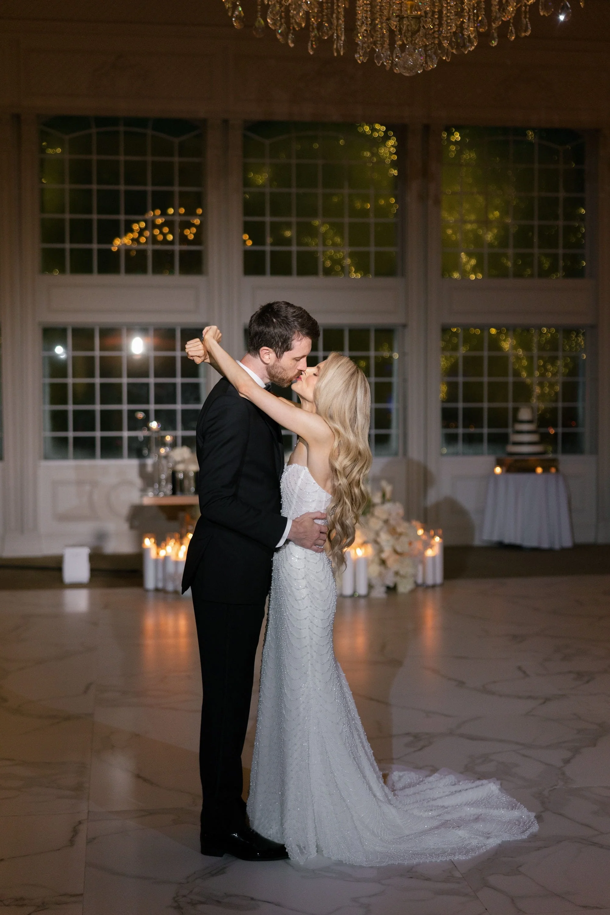 Caroline dancing with her arms around Brett during their wedding reception in River Vale, NJ