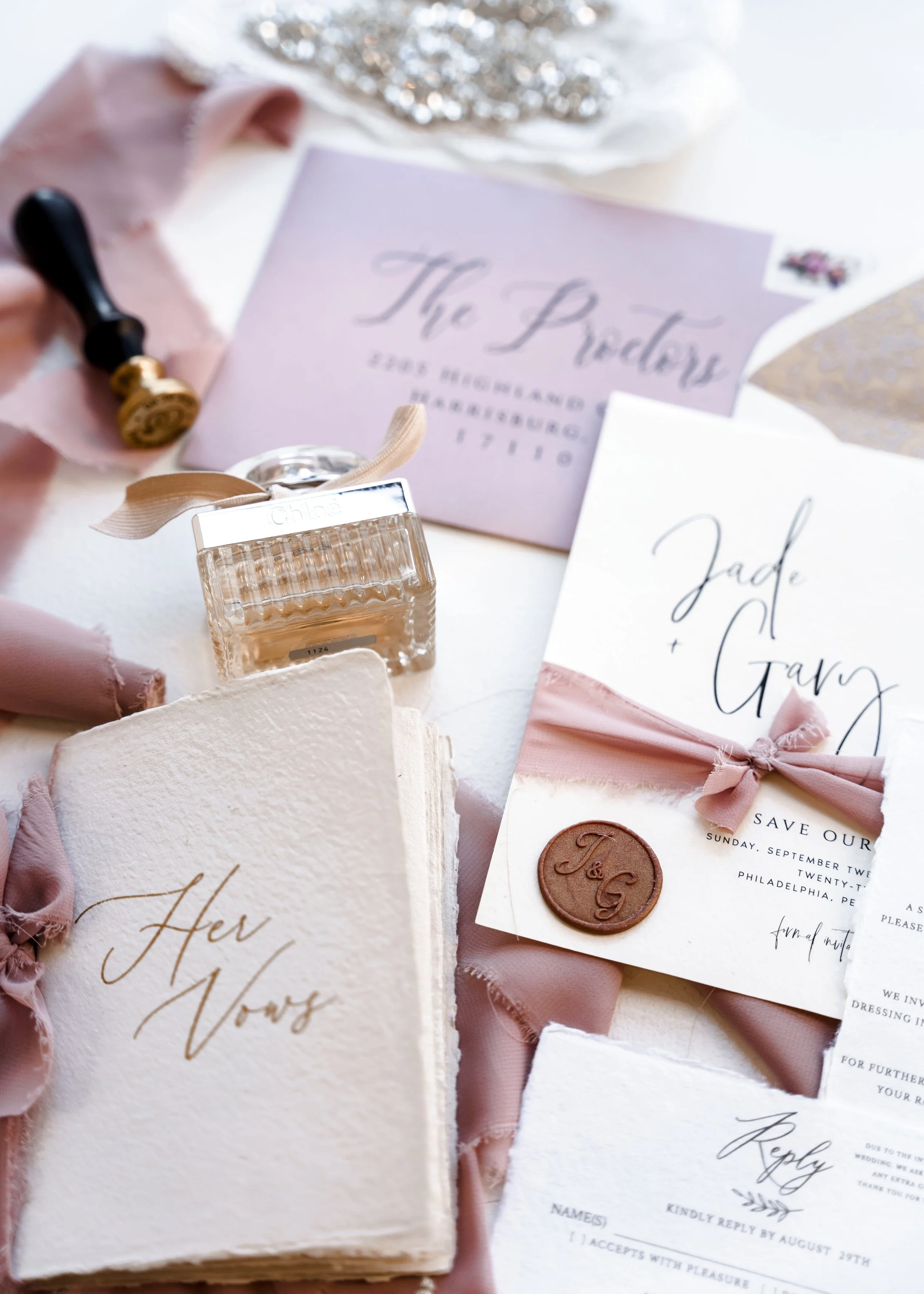 Elegant wedding invitation suite with calligraphy and wax seal detail at Kimpton Hotel Palomar in Philadelphia
