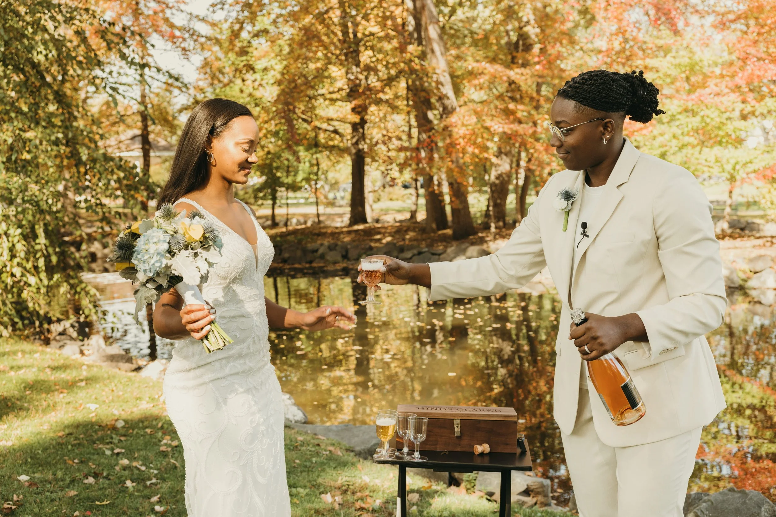 Jaide and Amiaya share a celebratory wine toast after their intimate elopement ceremony at Mindowaskin Park in Westfield, NJ.