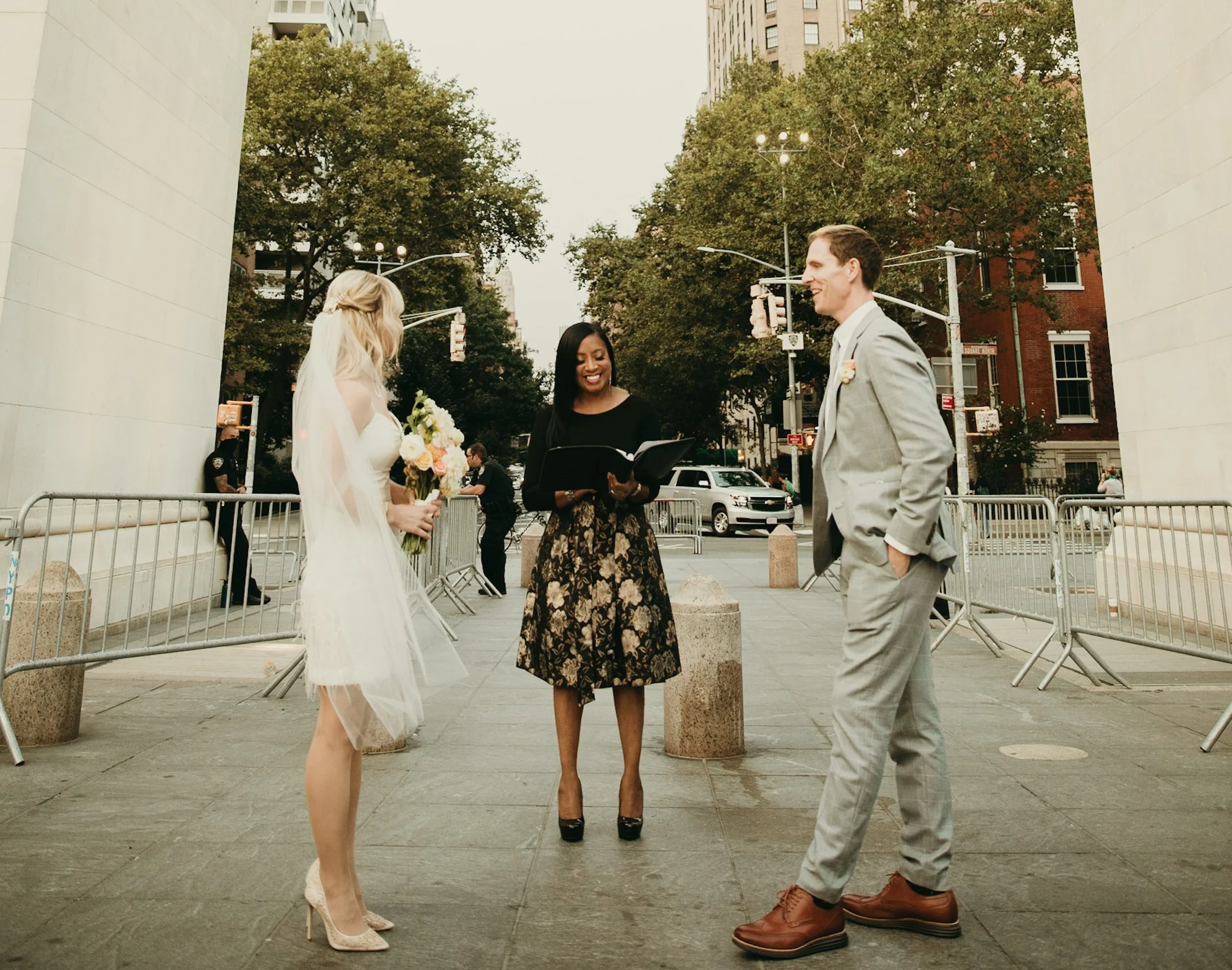 Aretha Gaskin officiating an intimate elopement ceremony, guiding a couple with professionalism and warmth during their vows