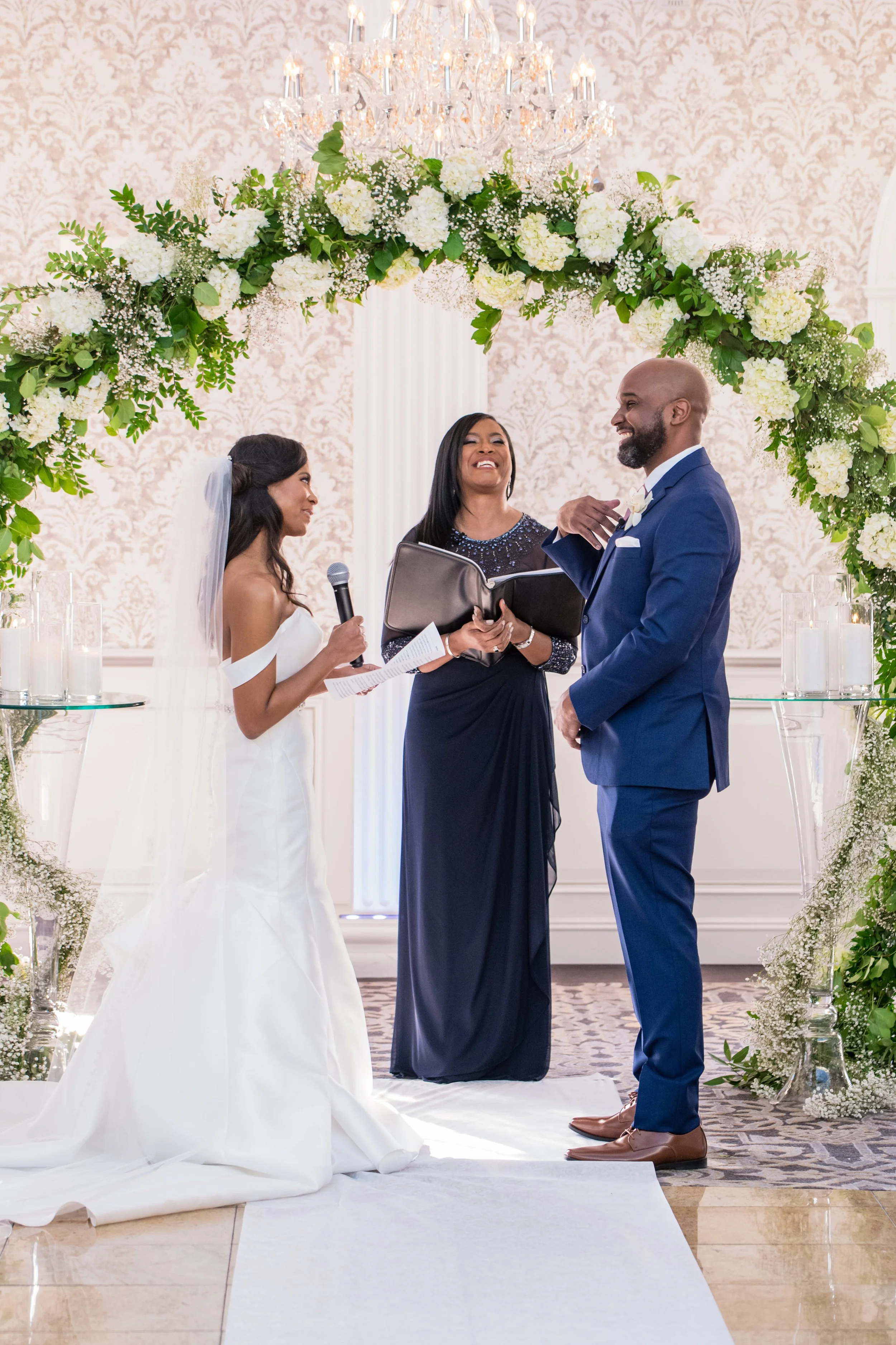 Officiant delivering a custom-written ceremony to a couple exchanging vows at The Merion in Cinnaminson, New Jersey
