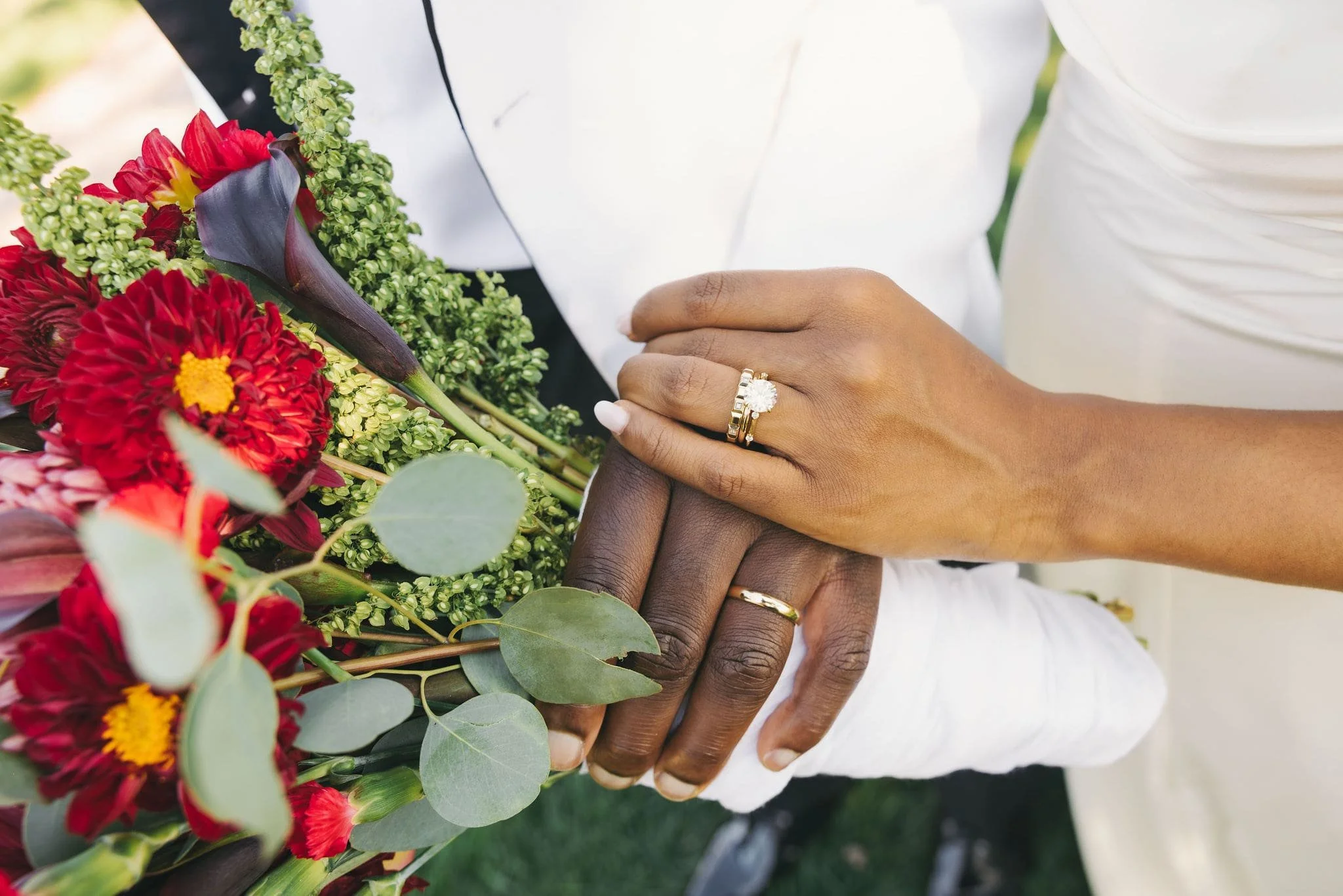 Close-up of wedding rings and hands during an outdoor elopement ceremony in New Jersey