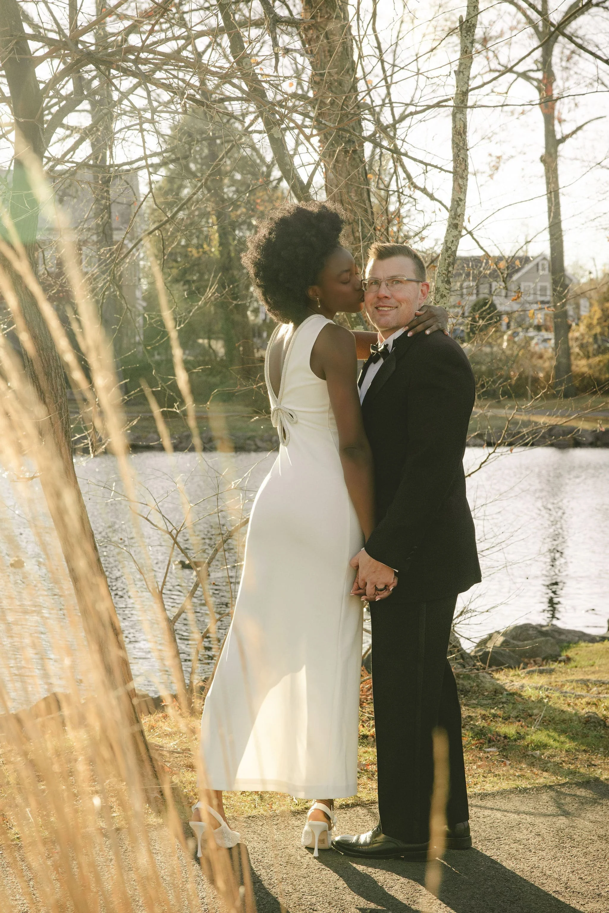 Couple standing together after a riverside elopement in Bergen County, New Jersey