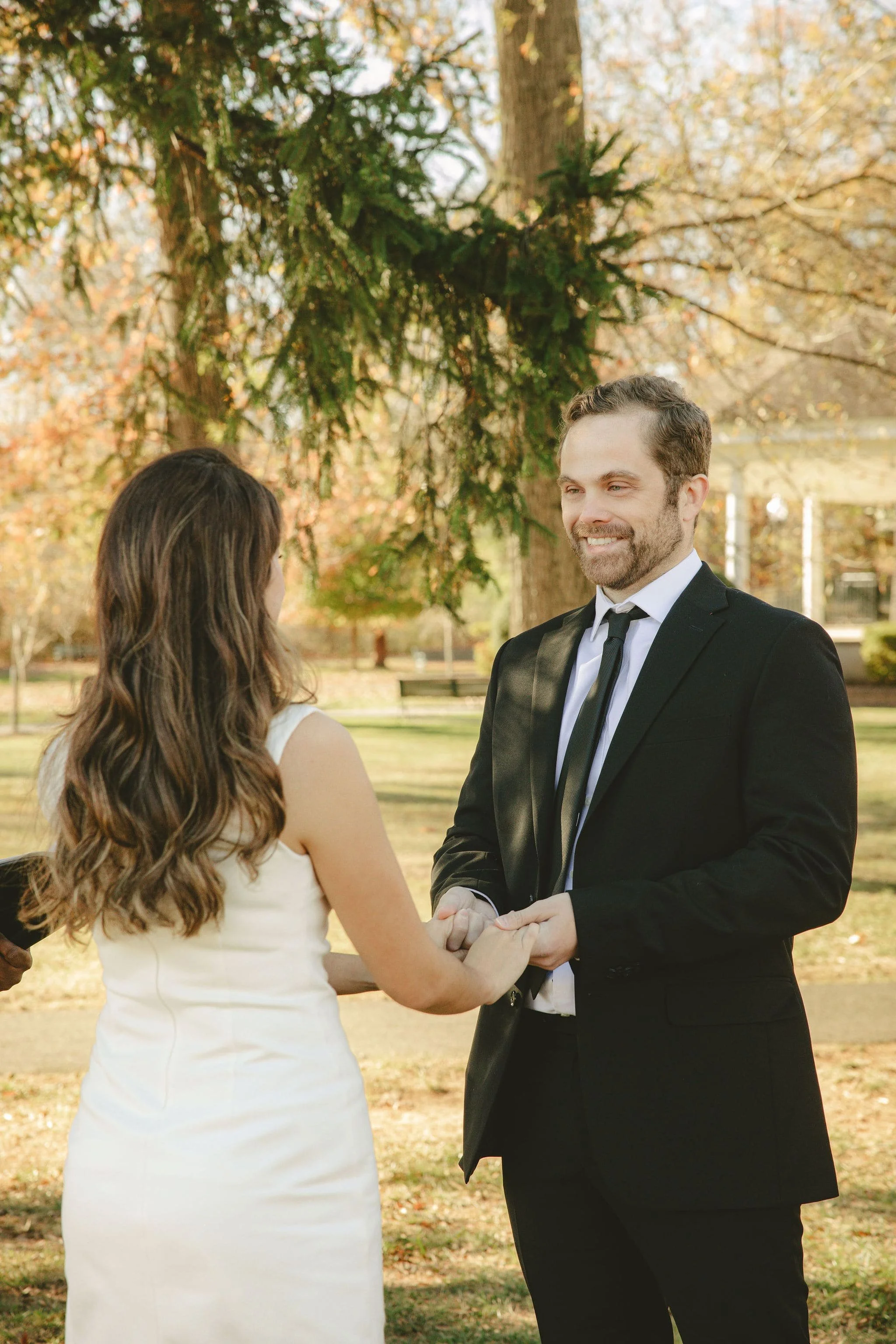 Couple exchanging vows during an intimate Monmouth County elopement in a quiet outdoor park setting