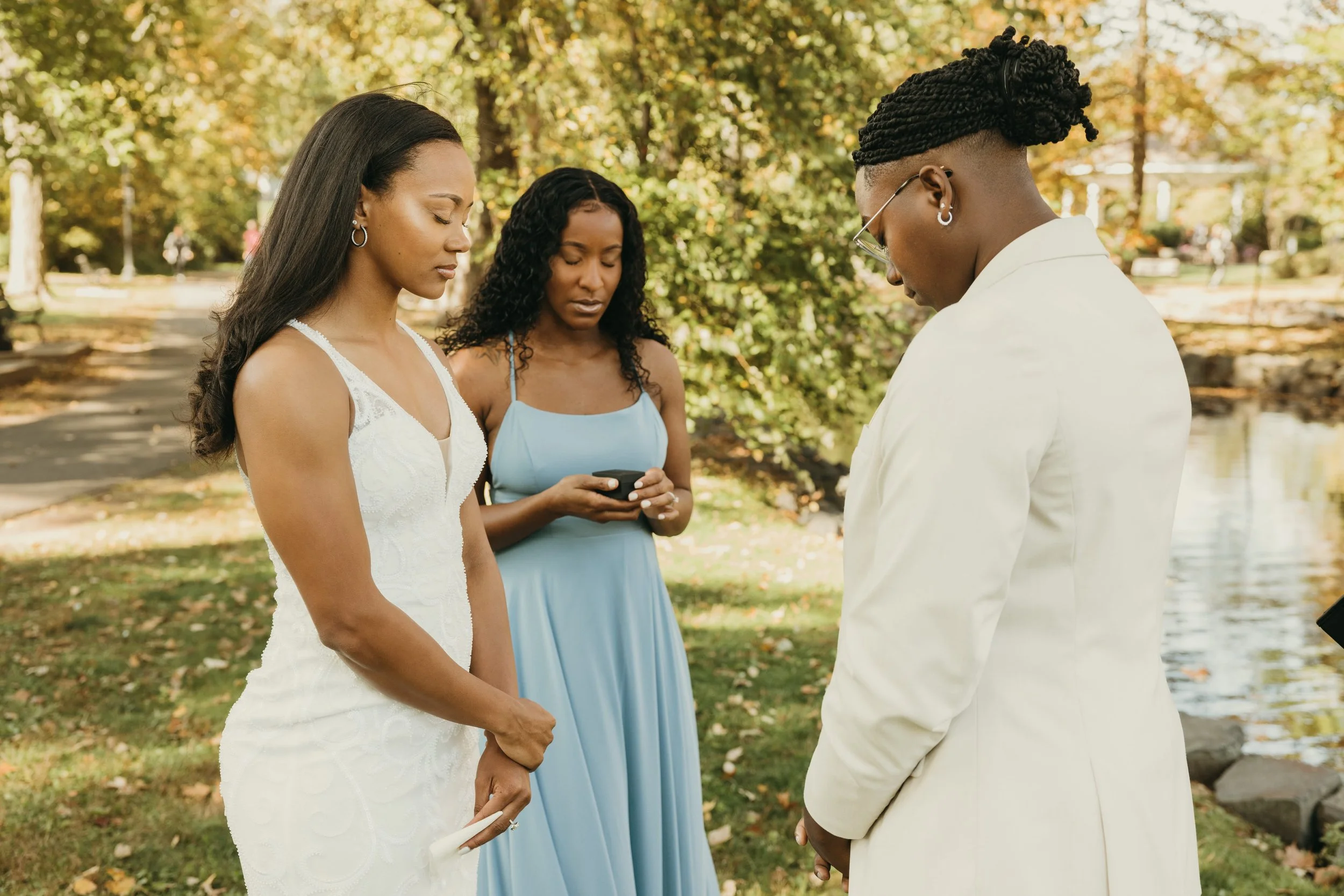 Jaide and Amiaya during a ring blessing led by their best friend at their intimate elopement at Mindowaskin Park in Westfield, NJ.