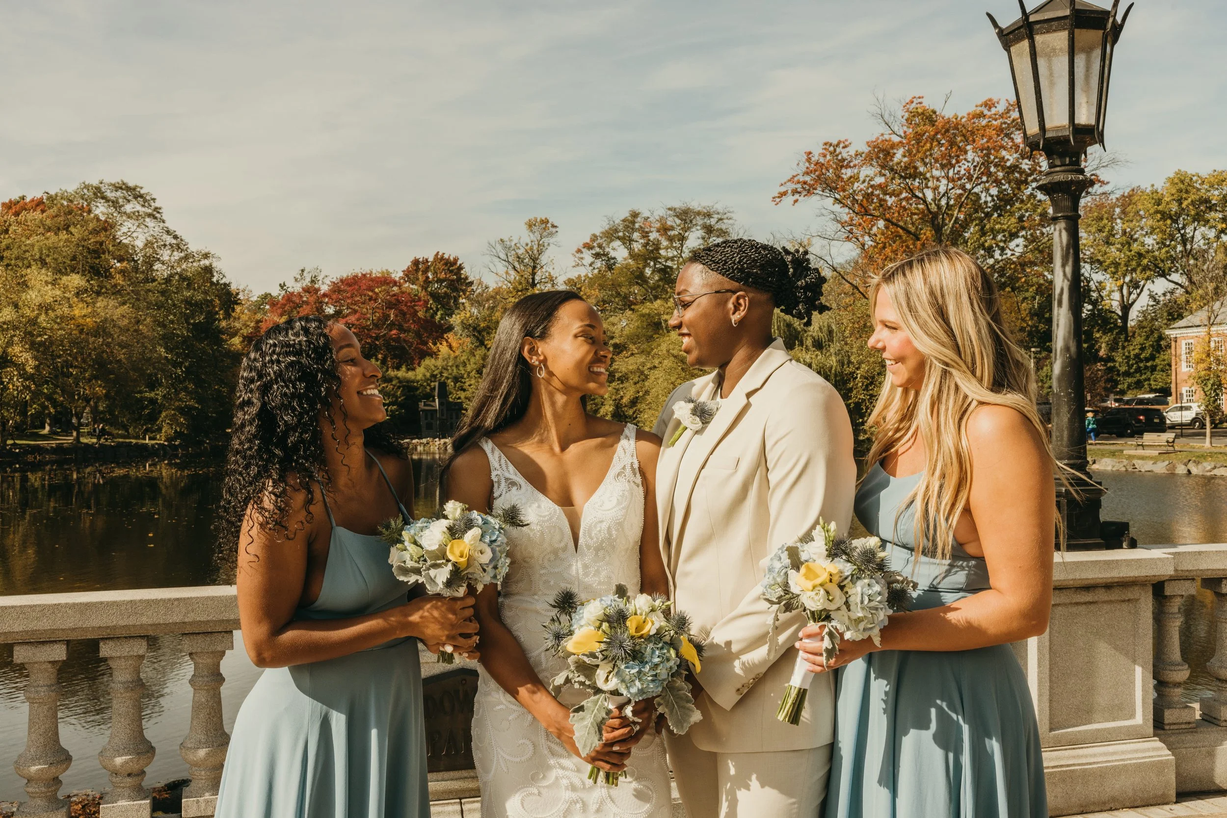 Jaide and Amiaya sharing a candid moment with their two best friends and witnesses after their Mindowaskin Park elopement in Westfield, NJ.