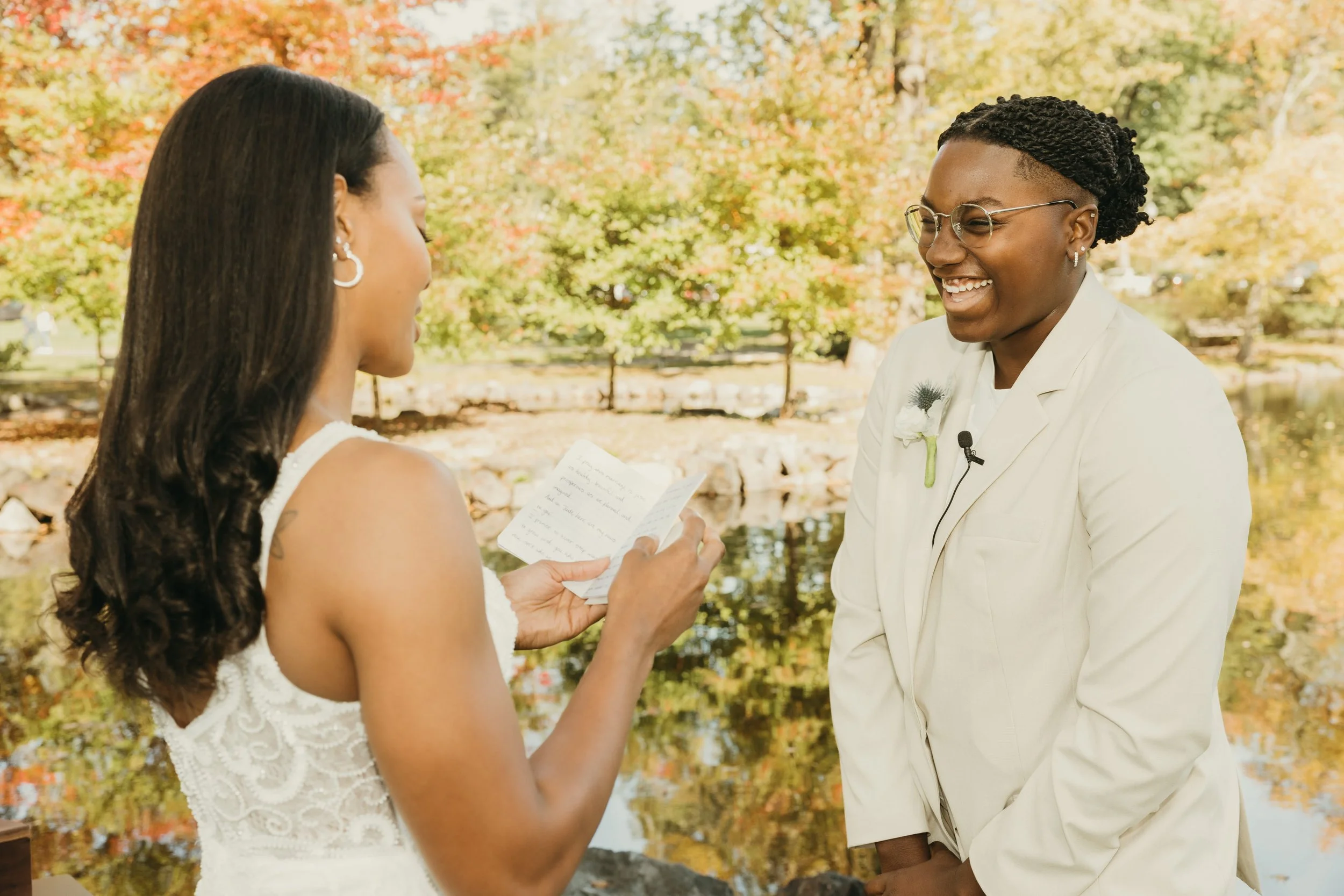 Amiaya reads her personalized vows as Jaide laughs during their intimate Mindowaskin Park elopement ceremony in Westfield, NJ.