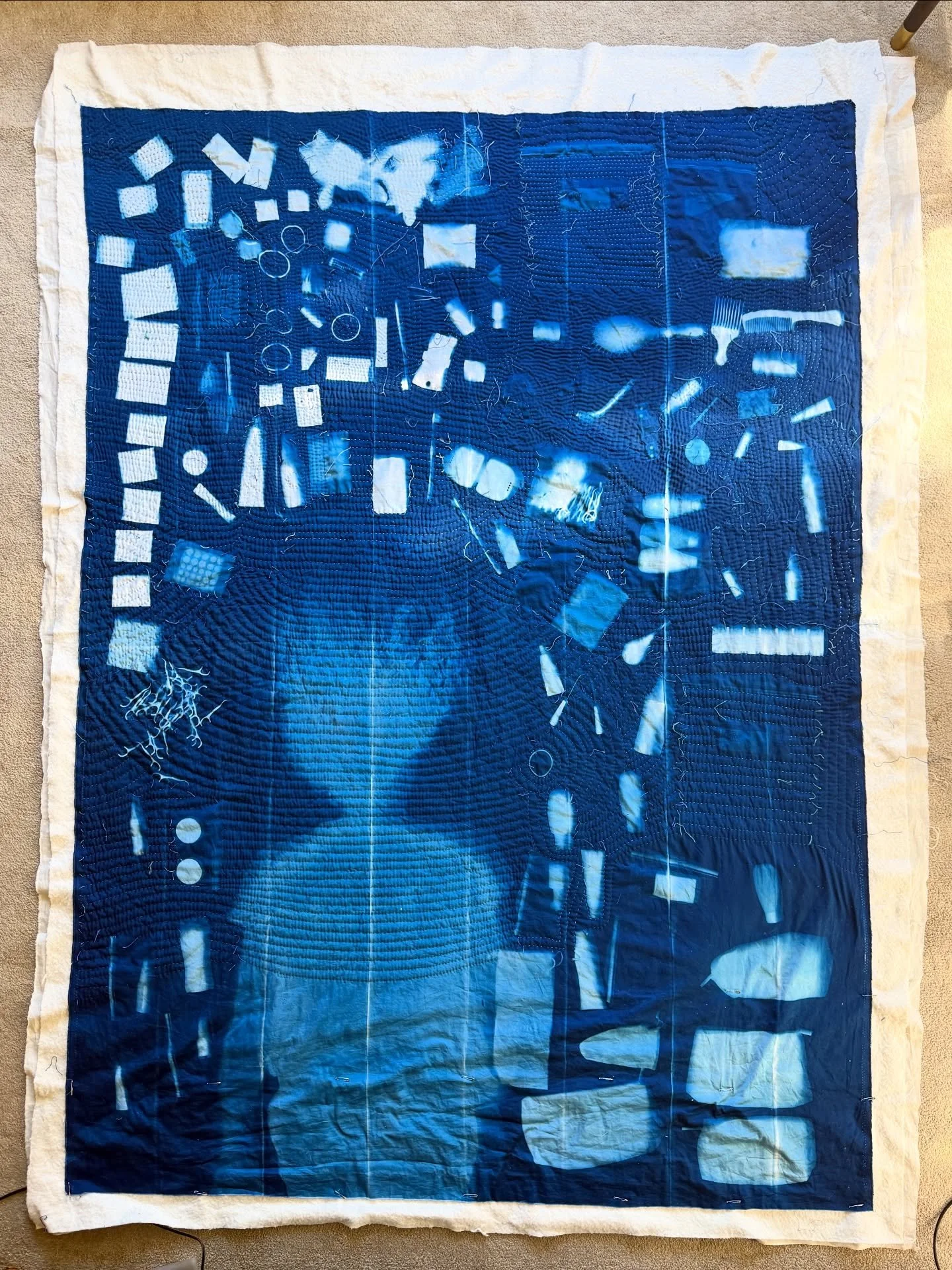 I&rsquo;m getting so close to this FINISH! I made the #cyanotype while visiting my mom in Florida this spring. 
I&rsquo;m loving this thin organic thread from @scanfilfinethread over the print of my body. 
🧵🪡
Feeling a bit torn about quilting over 