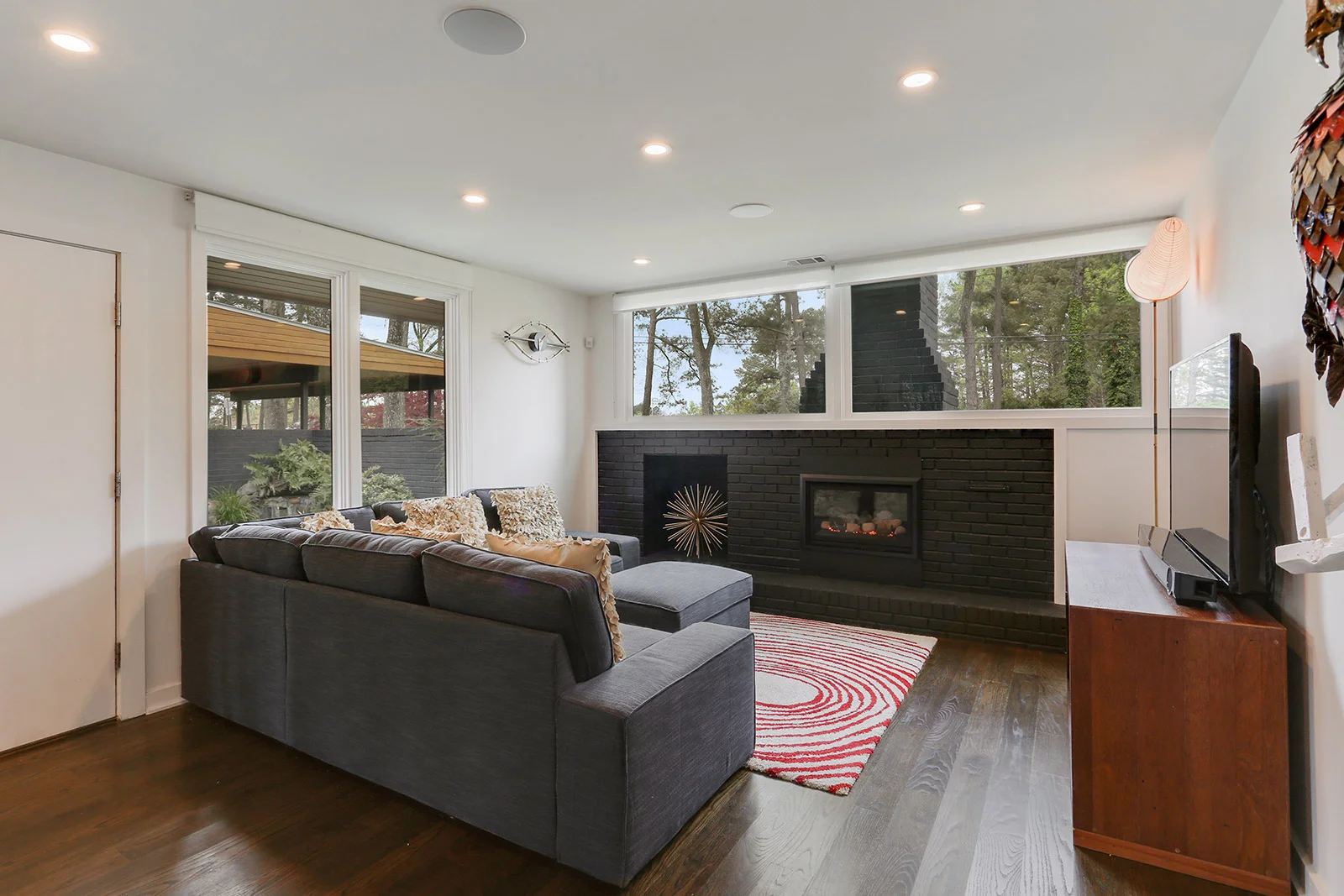 Views of outdoor waterfall from living room.