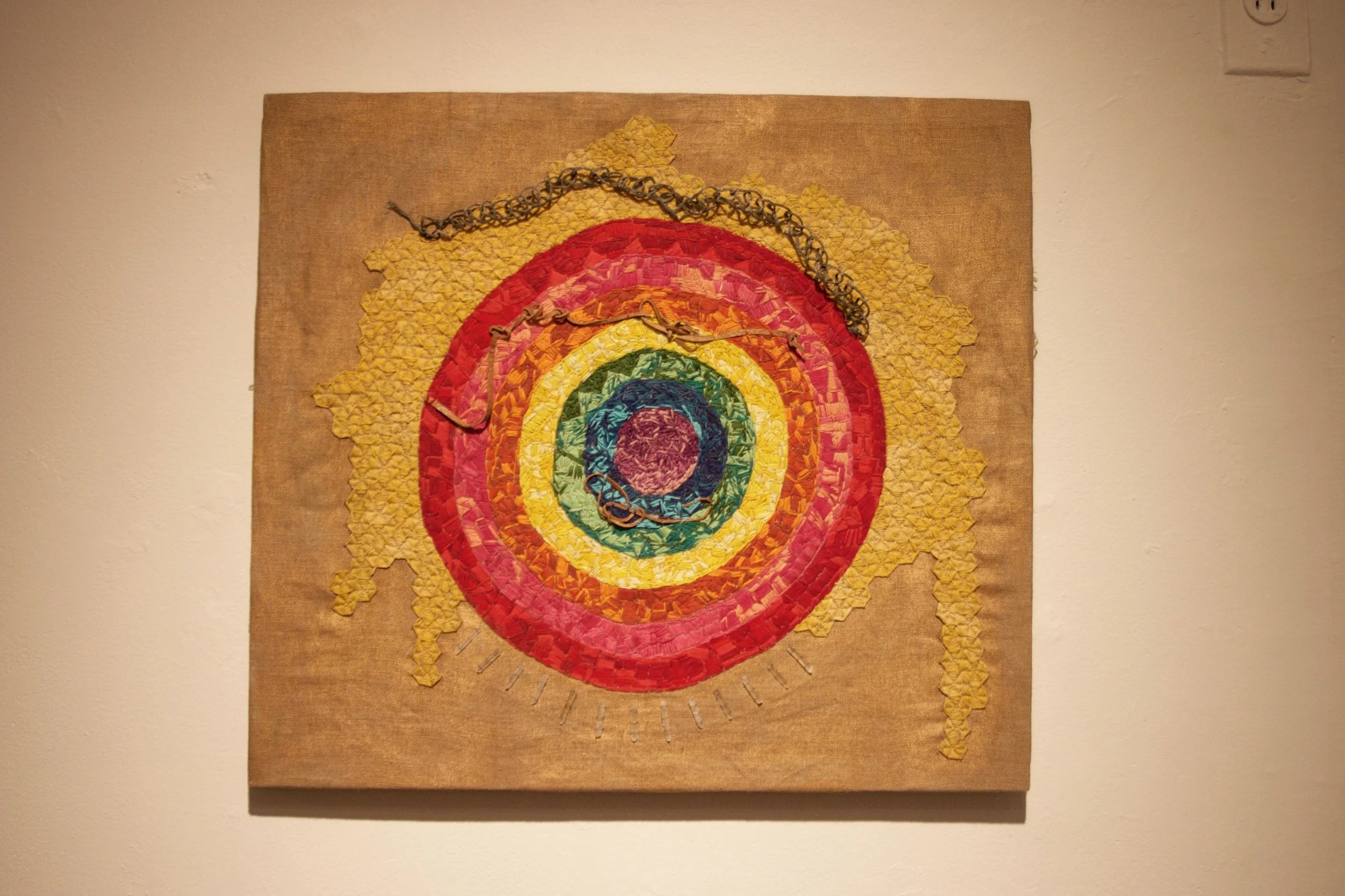 The Rainbow Circle , embroidery on linen with paint, wire, leather, and quartz crystals, 22 x 20 inches