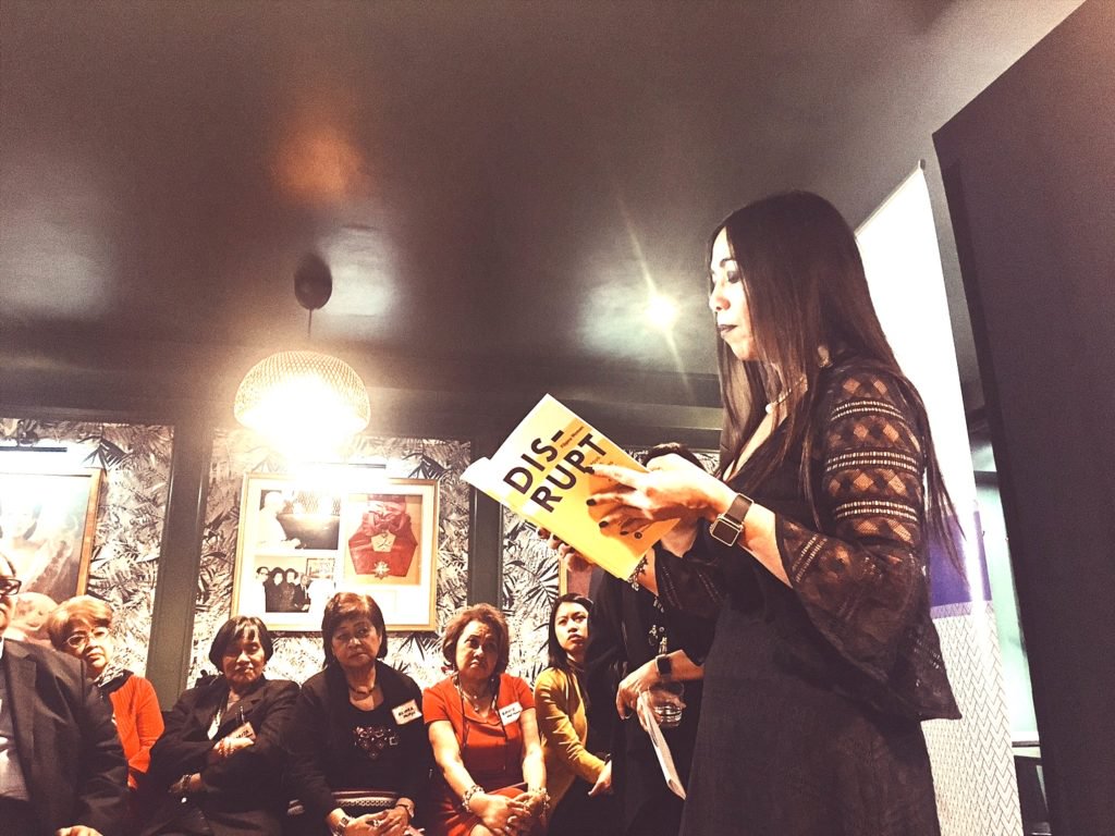 Rowena Romulo (Global FWN100™ '17) reads an excerpt from Filipina Women’s Network’s book “DISRUPT. Filipina Women: Proud. Loud. Leading Without a Doubt”