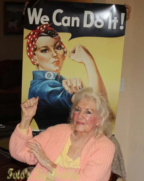 Naomi Parker Fraley poses in 2015 with the iconic Rosie the Riveter poster that became a feminist touchstone. Photo credit: John D. Fraley