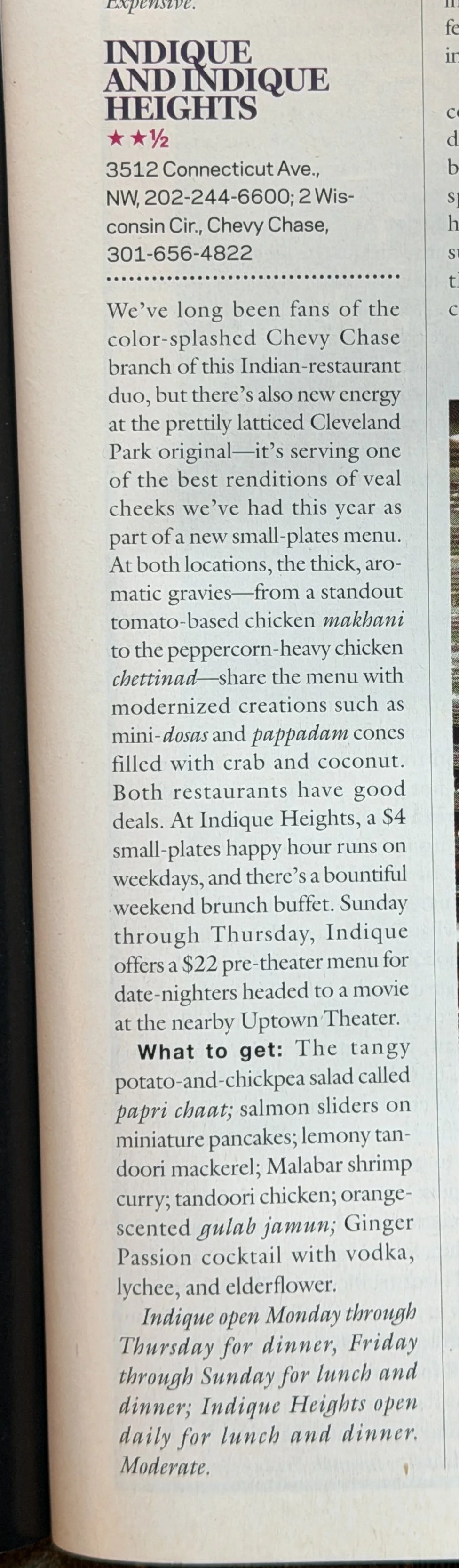 A newspaper clipping about Indique and Indique Heights restaurants, featuring their address, phone numbers, and menu highlights, including veal cheeks, chicken makhani, chicken chettinad, dosa, and pappadam, with information on happy hour and theater menu.