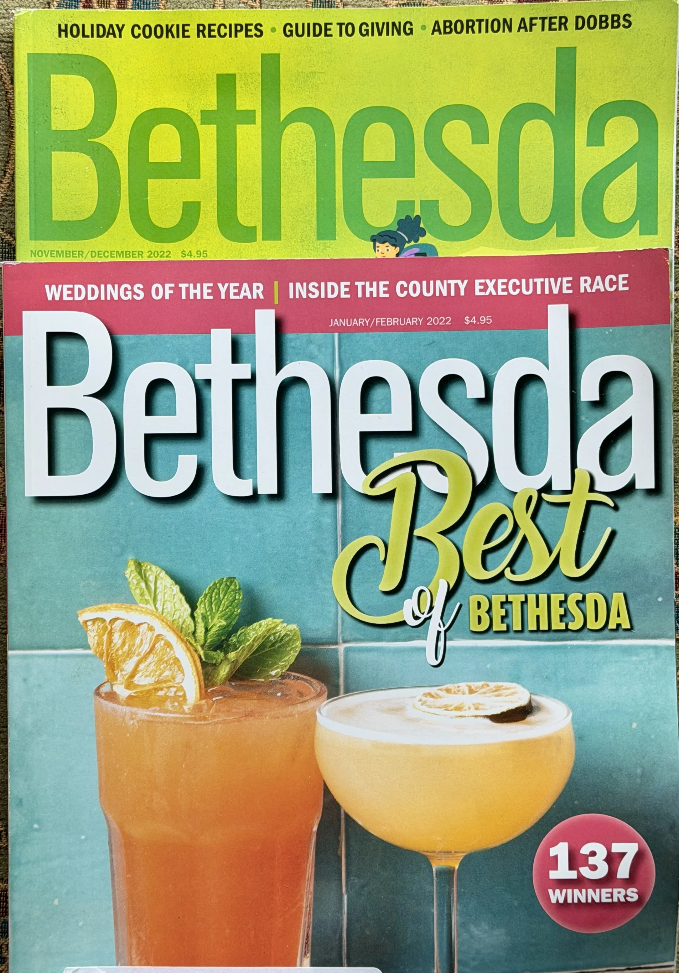 Cover of Bethesda magazine featuring the title 'Bethesda Best of Bethesda' with images of two cocktails, one garnished with lemon and mint, and a slice of lemon, on a turquoise tiled background.