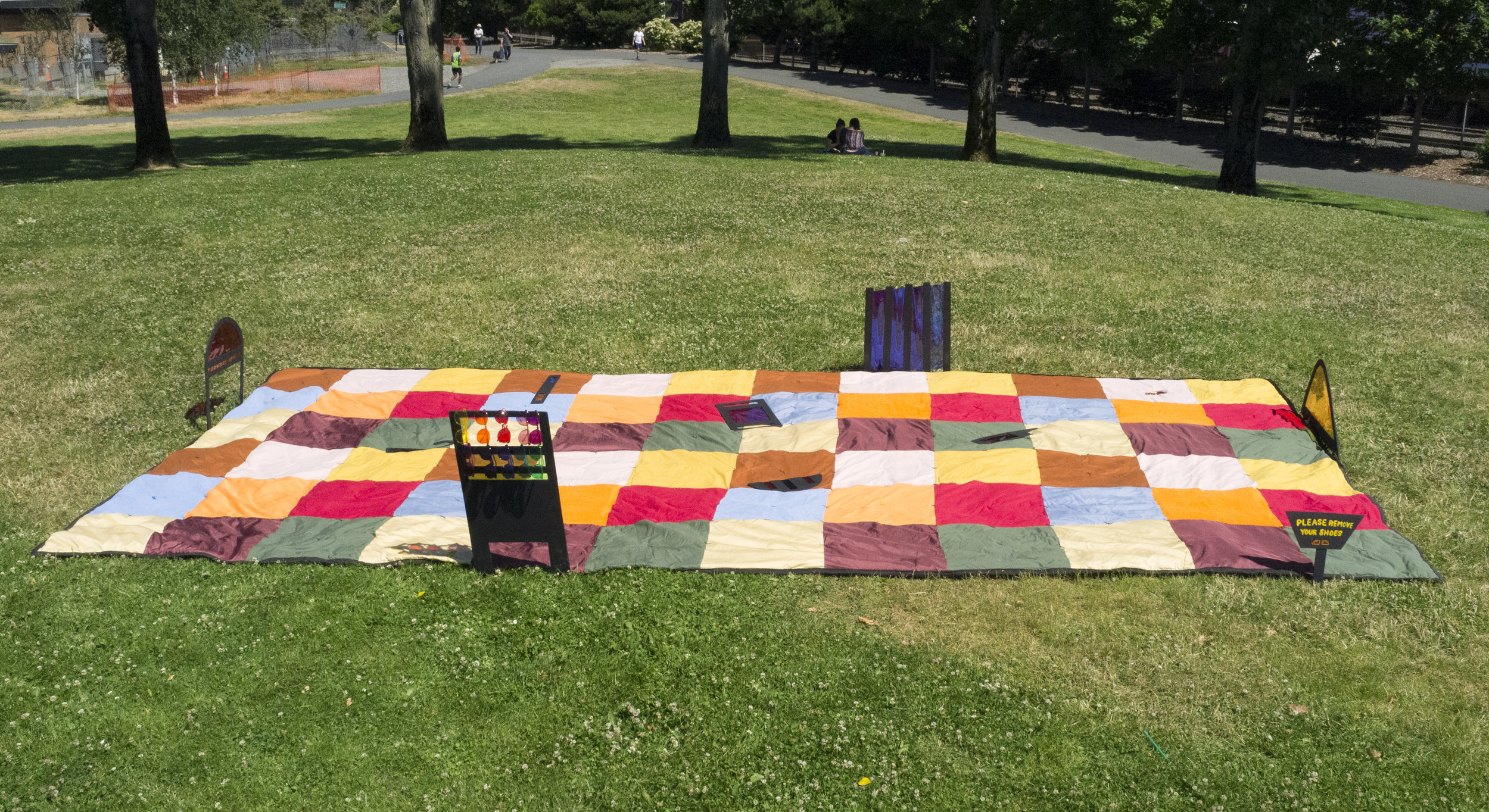 Lens Therapy Situation specific installation Summer 2017 Found fabrics, batting, acrylic on panel, colored gels, color therapy glasses, Myrtle Edwards Park, publication 20 x 10 x 3 feet