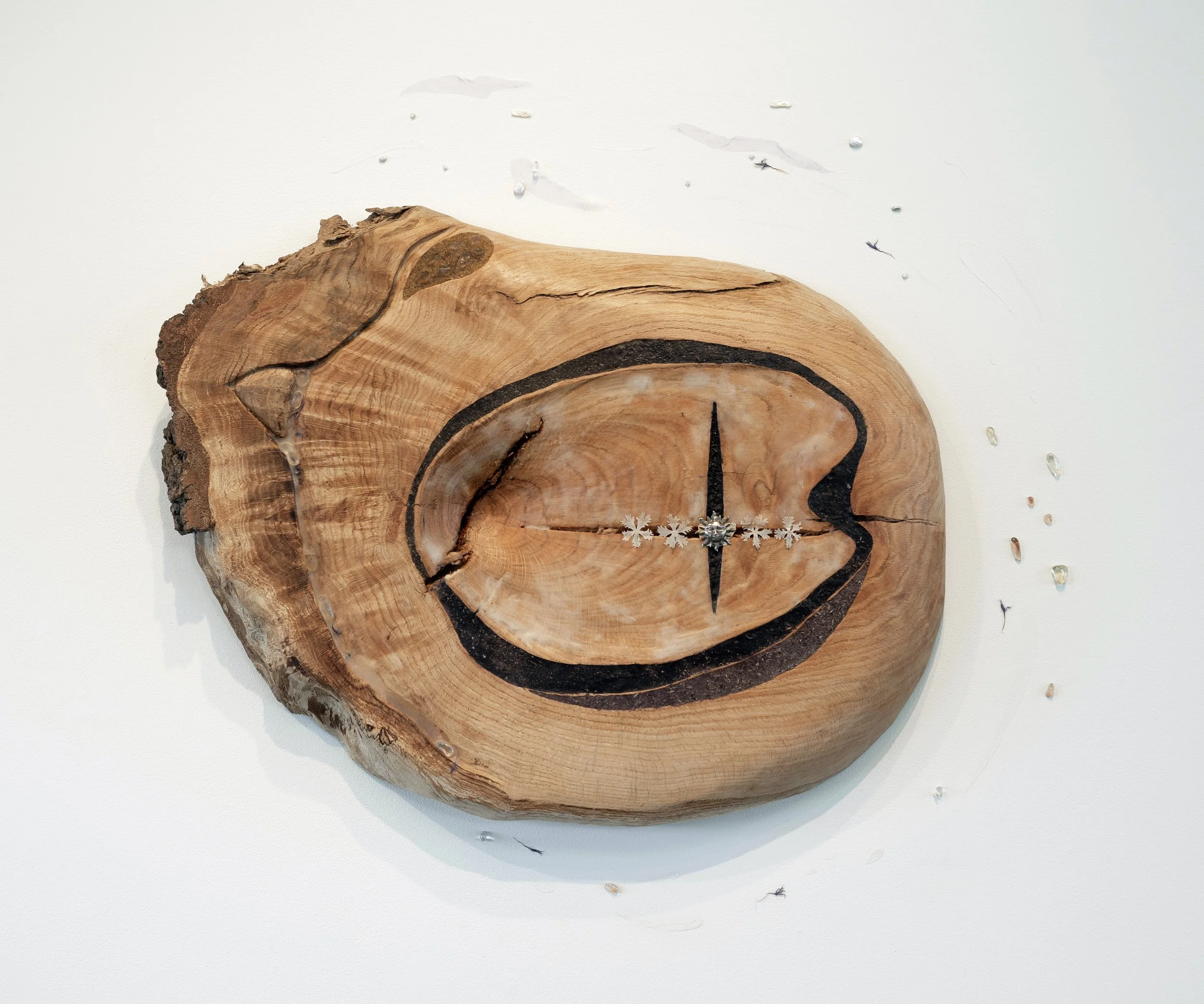 Global Rupture,
2025,
Carved reclaimed red oak, Oregon sunstones, mother’s earring, beeswax, ground Iris petal powder, cornflower, charcoal, calendula, musk mallow, azalea,
26 x 20 x 3 inches 