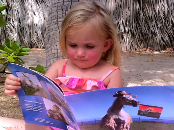 Hoku (the little girl who inspired the book) Reading Skeeter's Dreams