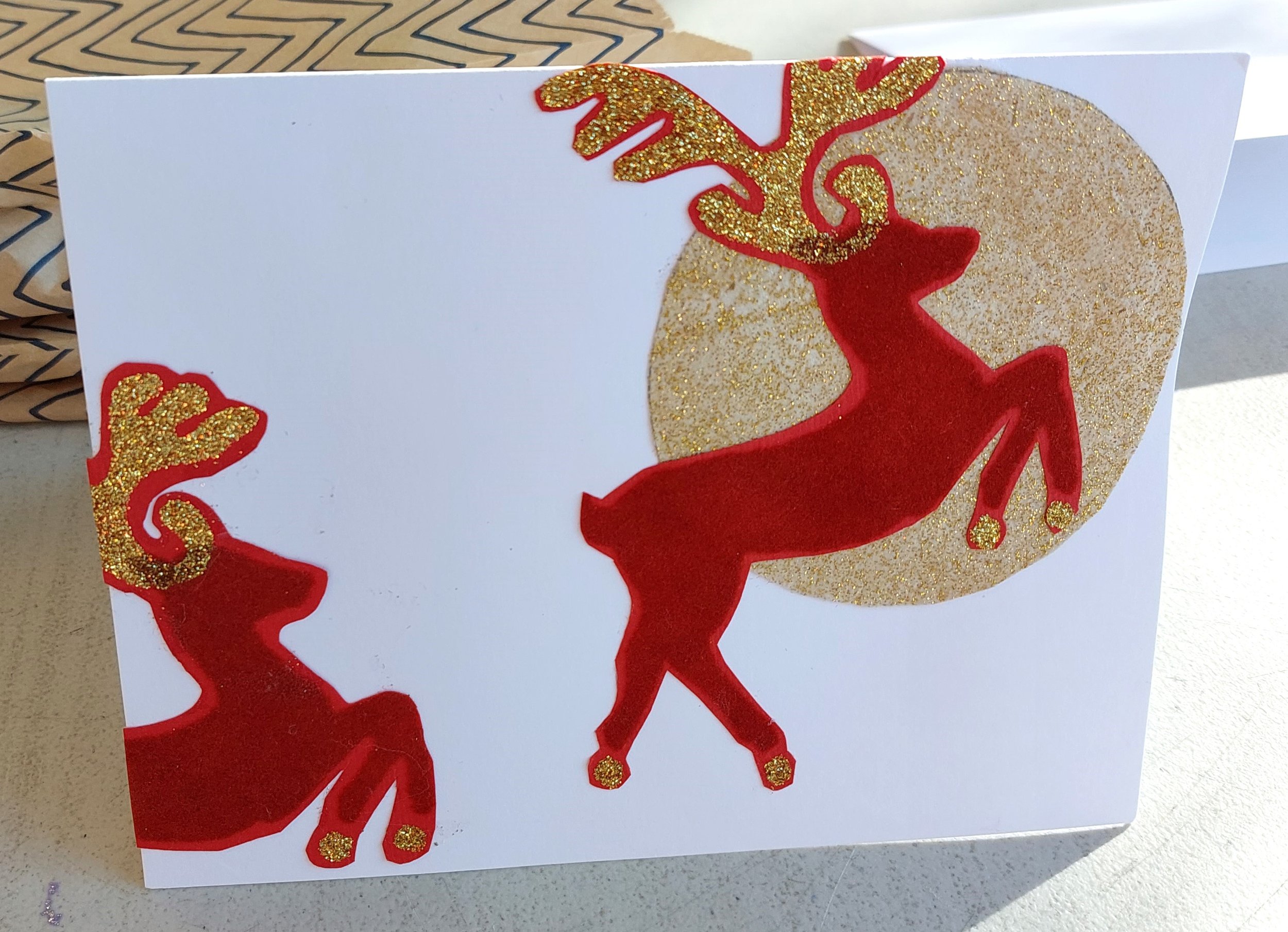 The garden club gathered for holiday festivities which included creating 100 holiday cards for the clients of Meals on Wheels. Following are 4 of the 8 designs created.
