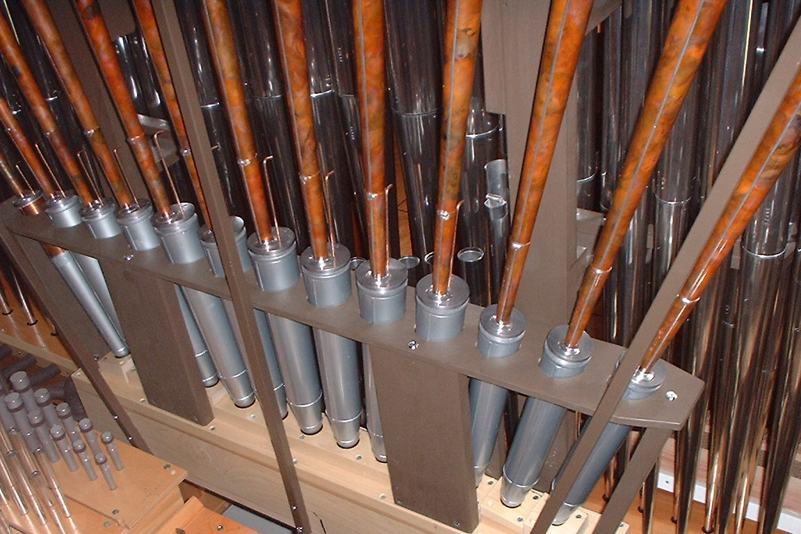 A look inside the organ, including the flamed copper 16' Pedal Posaune.