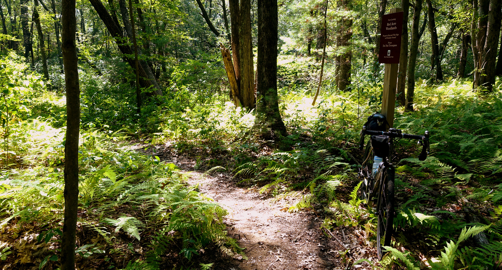 This is a good example of a "no trespassing" sign running parallel to the trail. As long as the route stays to the left of the sign, we're legal.