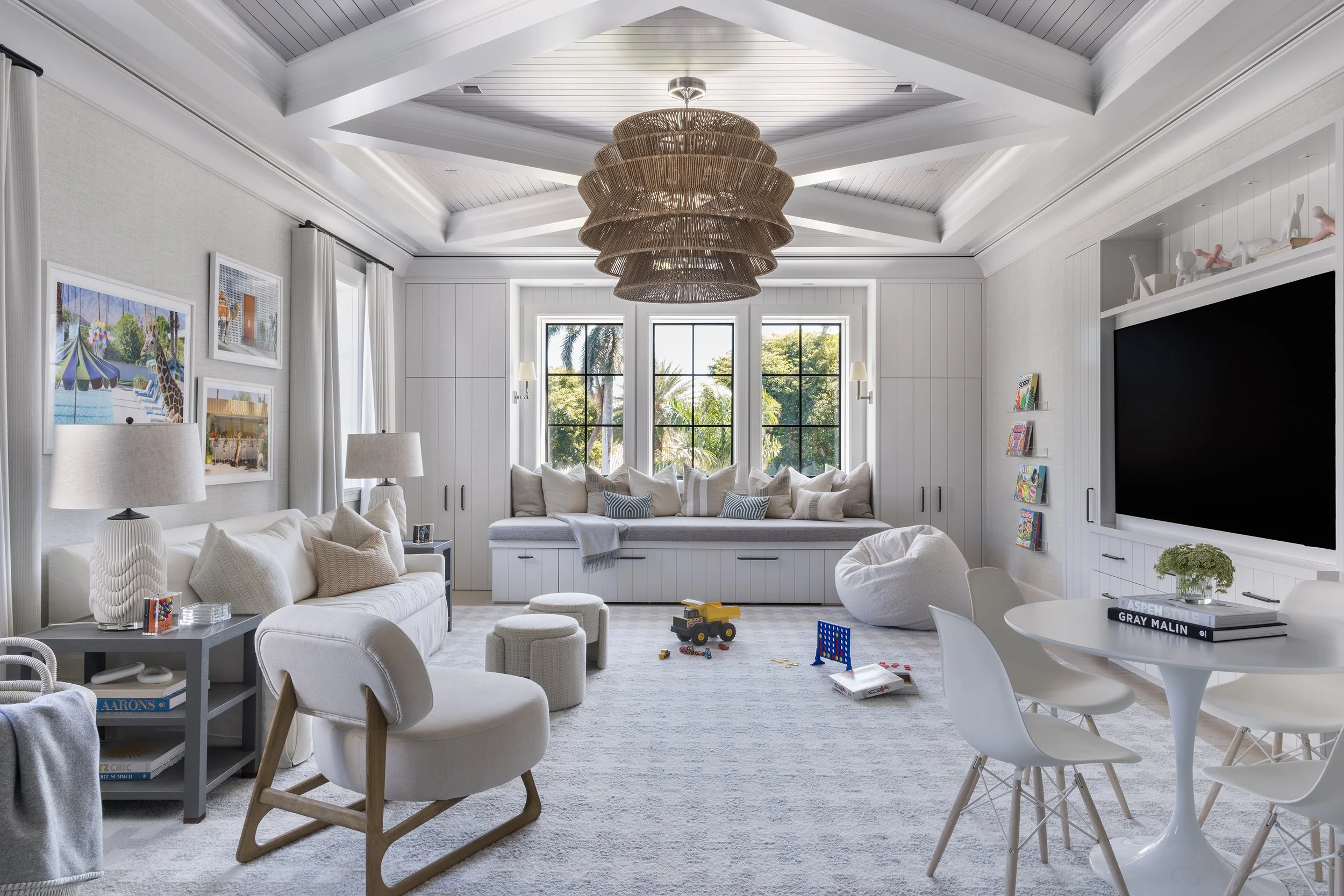 Bright family living space with built-in seating, layered furnishings, and soft natural light.