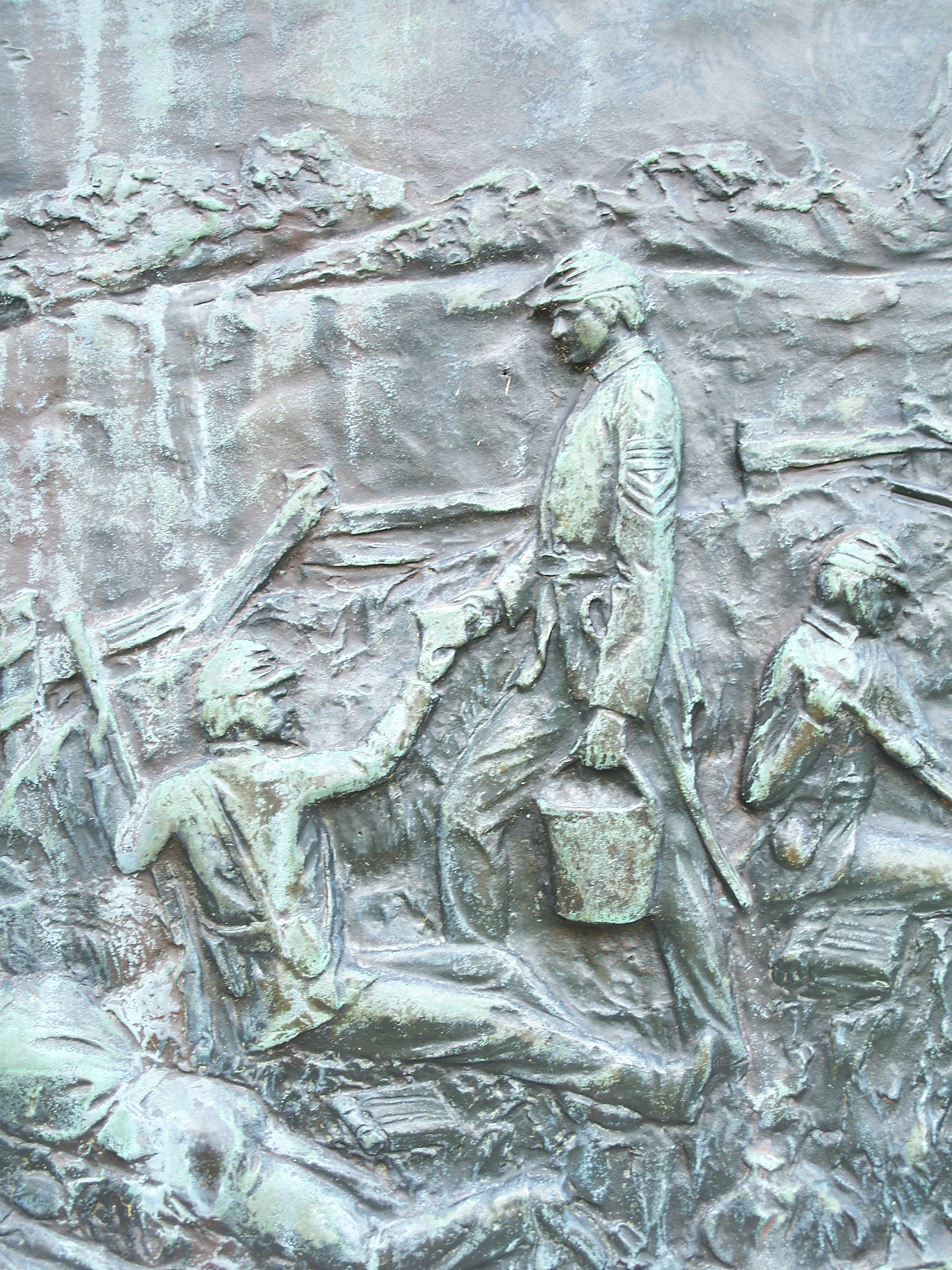  This relief tablet depicts McKinley bringing coffee to tired and wounded solders during the battle. 