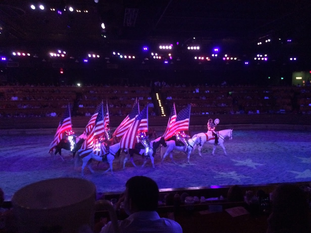 Competitors from both sides - North and South - end the night's events carrying American flags.