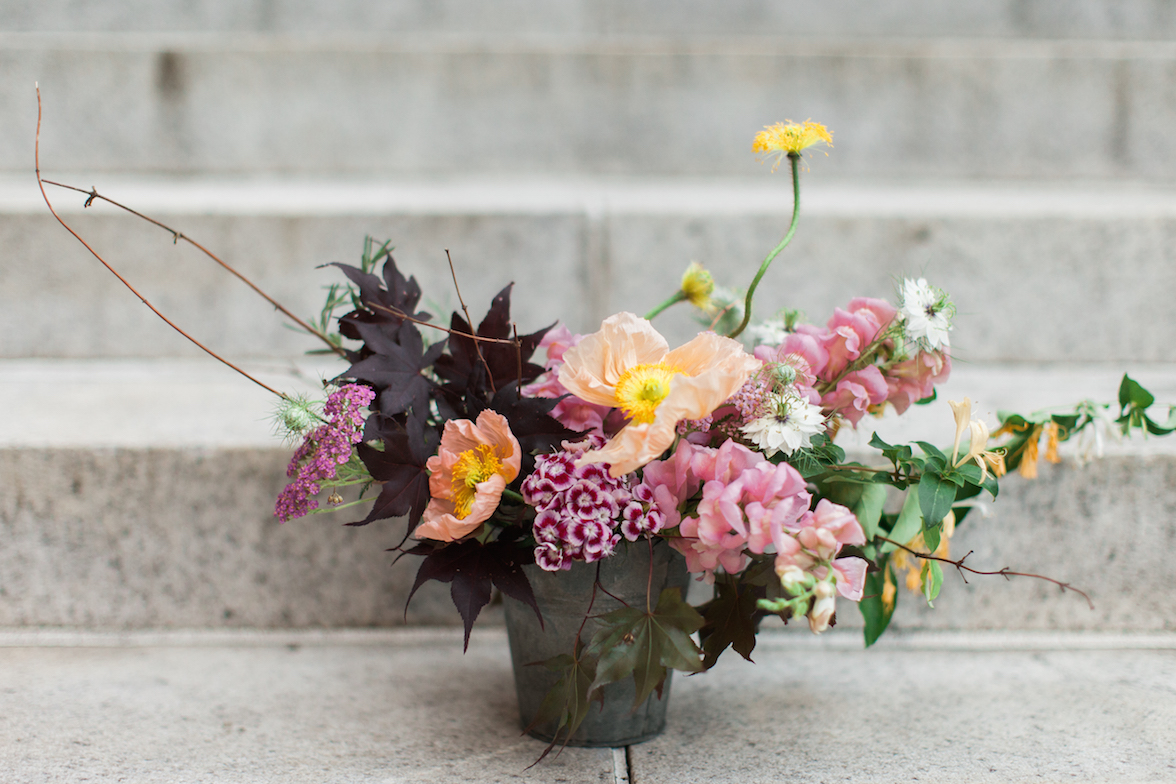 Demo piece composed of yarrow, poppies, dianthus, snapdragons, love-in-a-mist, honeysuckle, and japanese maple