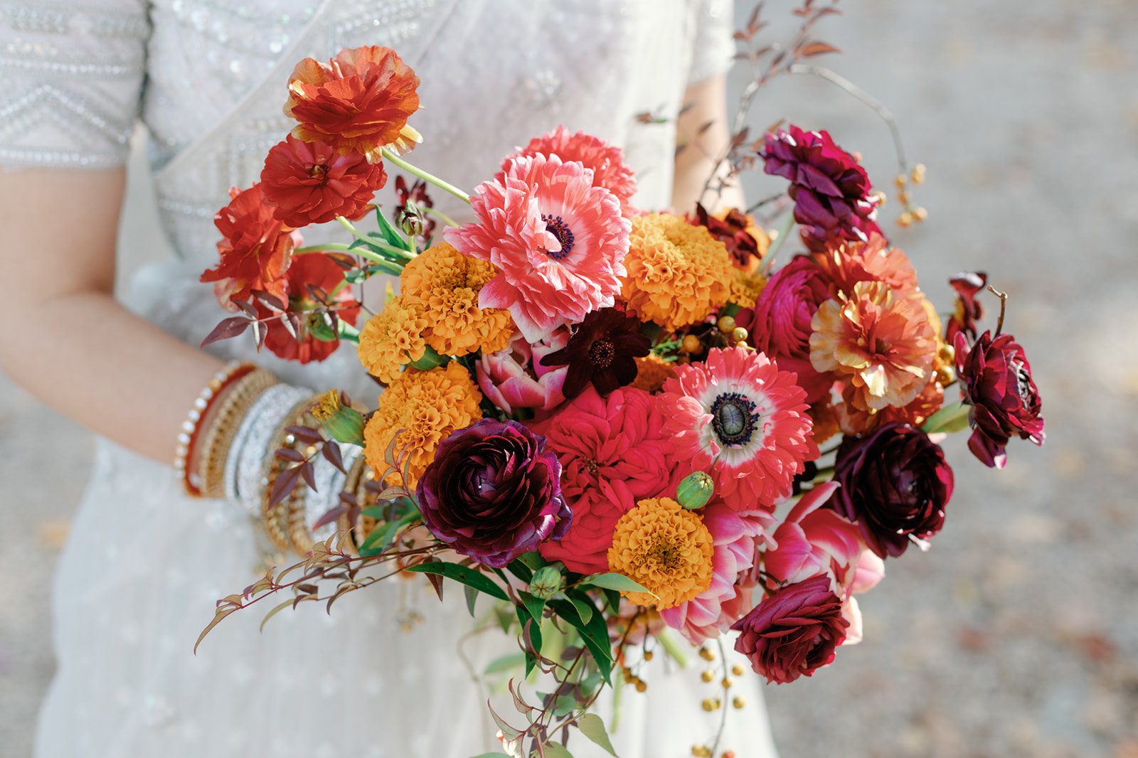 Colorful Indian wedding bouquet with marigolds in Charlottesville, Virginia