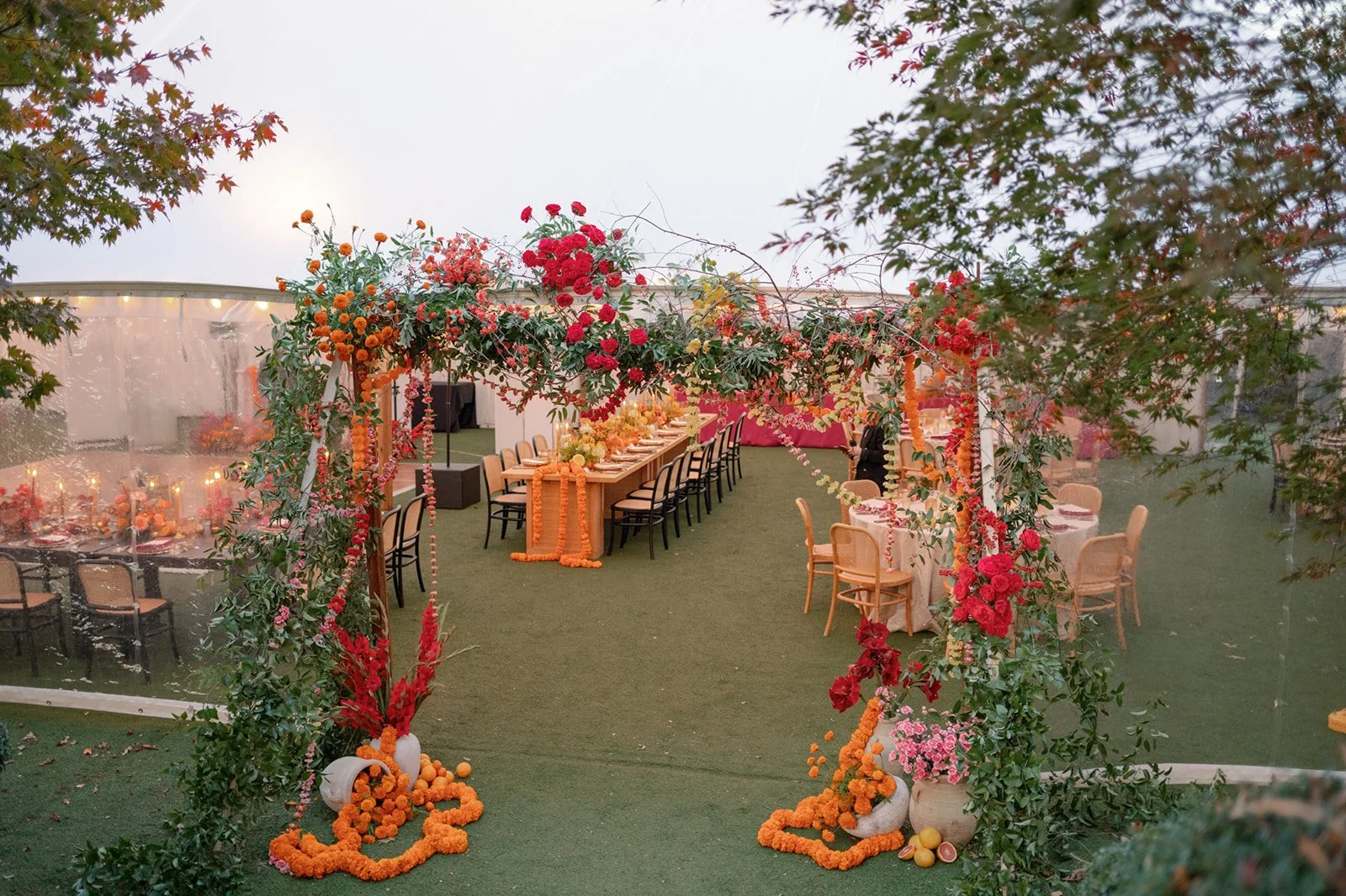 Tent entrance with marigold garlands at Keswick Vineyards in Charlottesville, VA