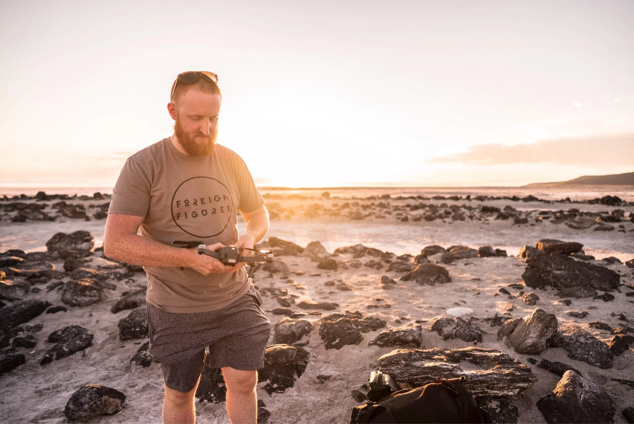An image of @sickniq readying one of his drones prior to a sunset shoot at a Utah Favorite Location