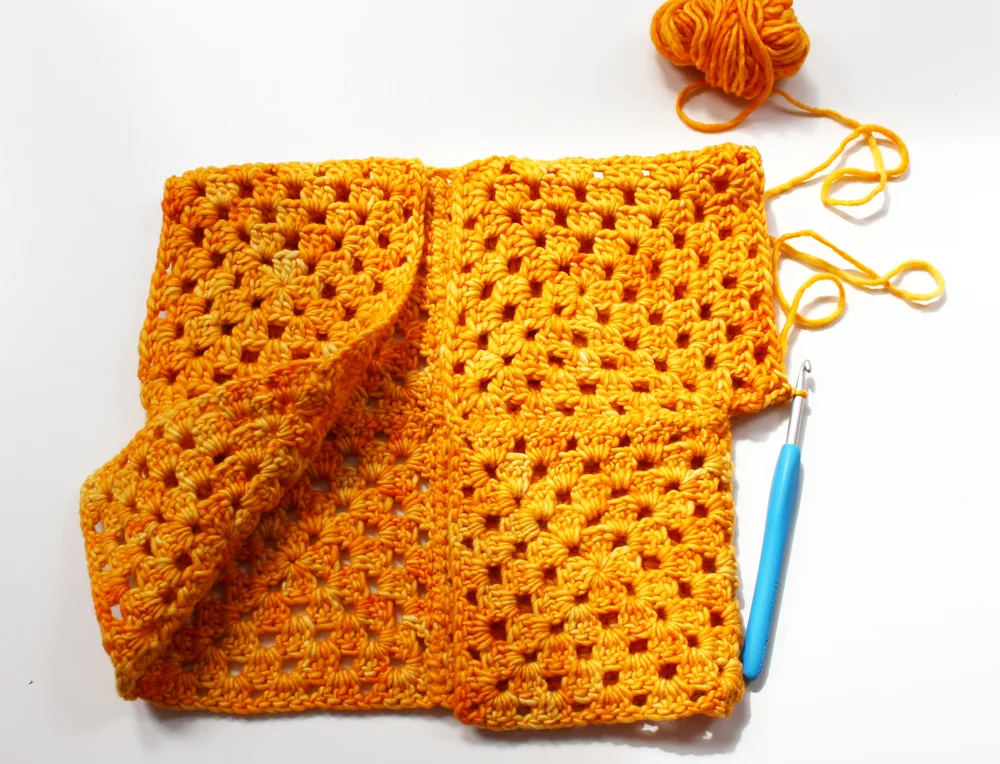 sew two rows of grannies to each arm.jpg