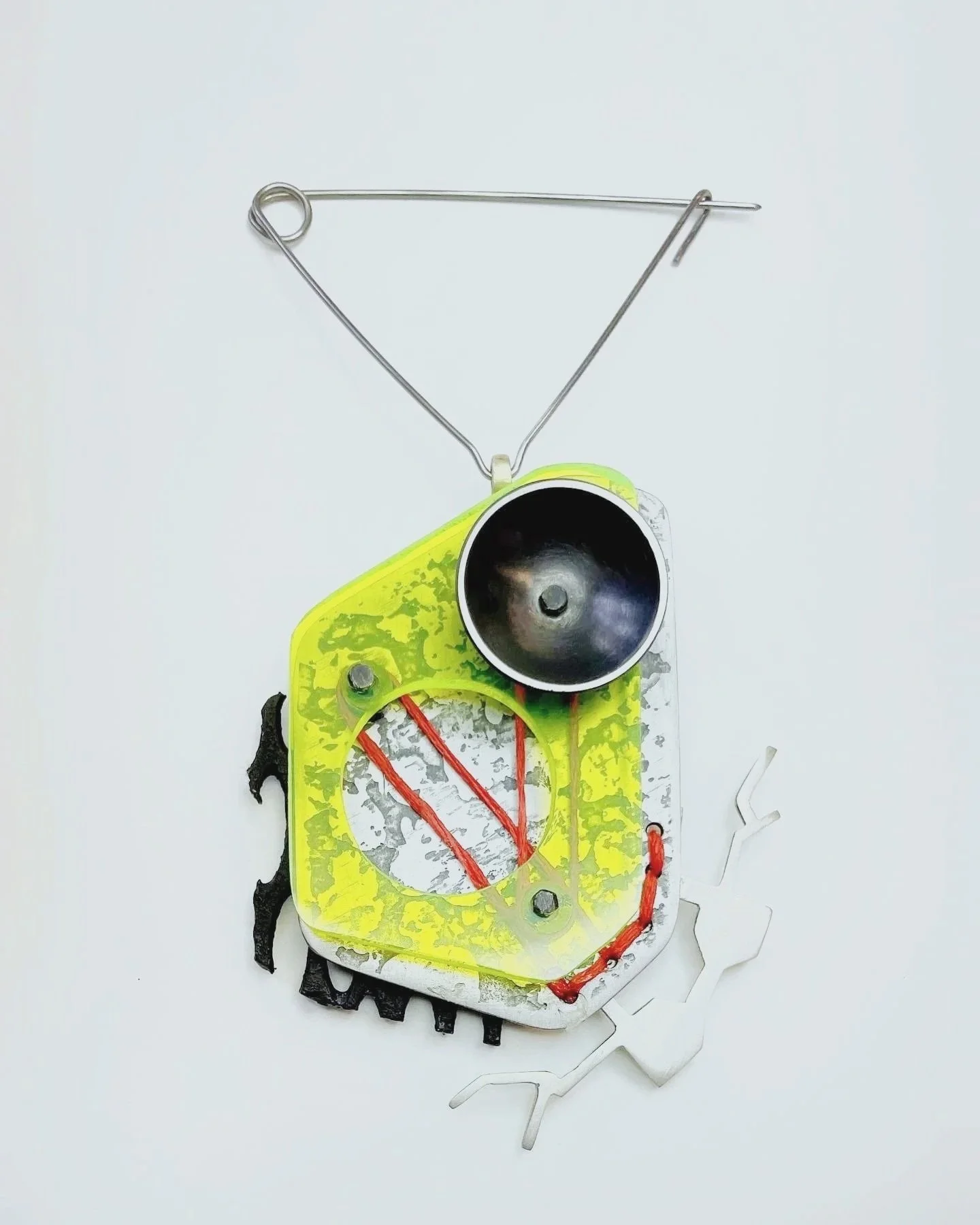broach: sterling silver, steel, acrylic, string, radiation mask fragment, brass
