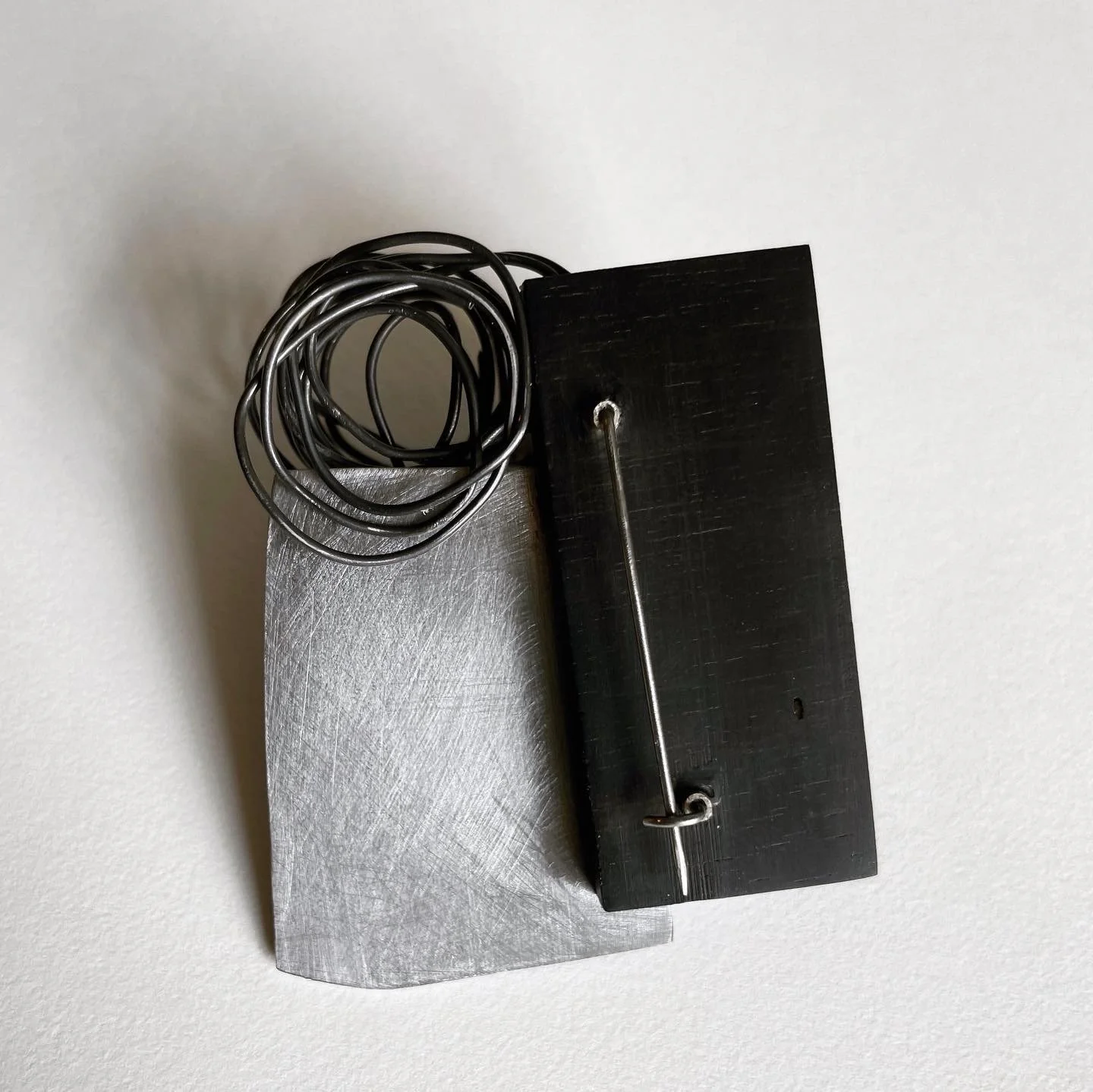broach: steel, ebony