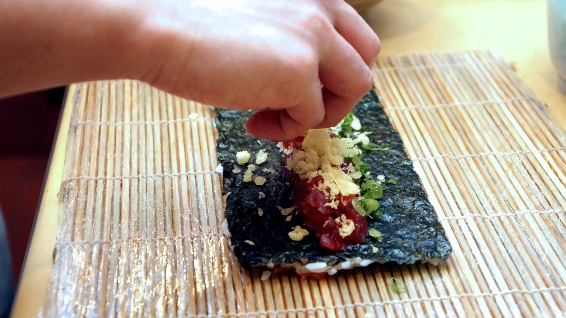 Chef making sushi roll