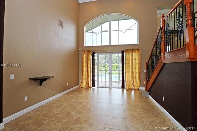 Room looks and feels dark and lifeless. Curtains are blocking natural light.