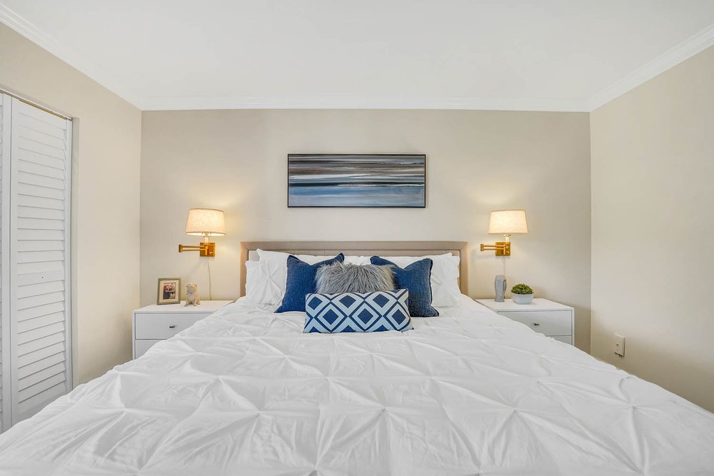 Potential Buyers Can Easily See Themselves in this Blue &amp; White Bedroom