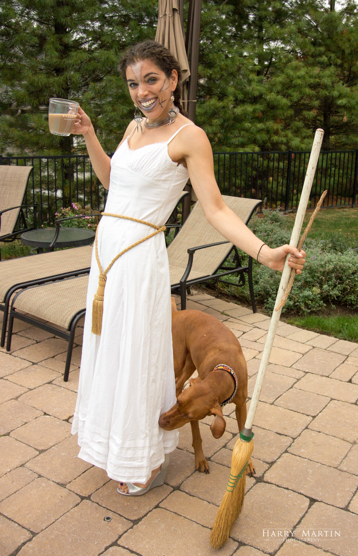 Amy Hope with "real" witch broom, Starbucks, and supervision from Lucy, the dog.