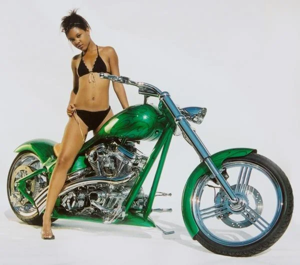 Lalisha Standing on Green Bike Looking.jpg