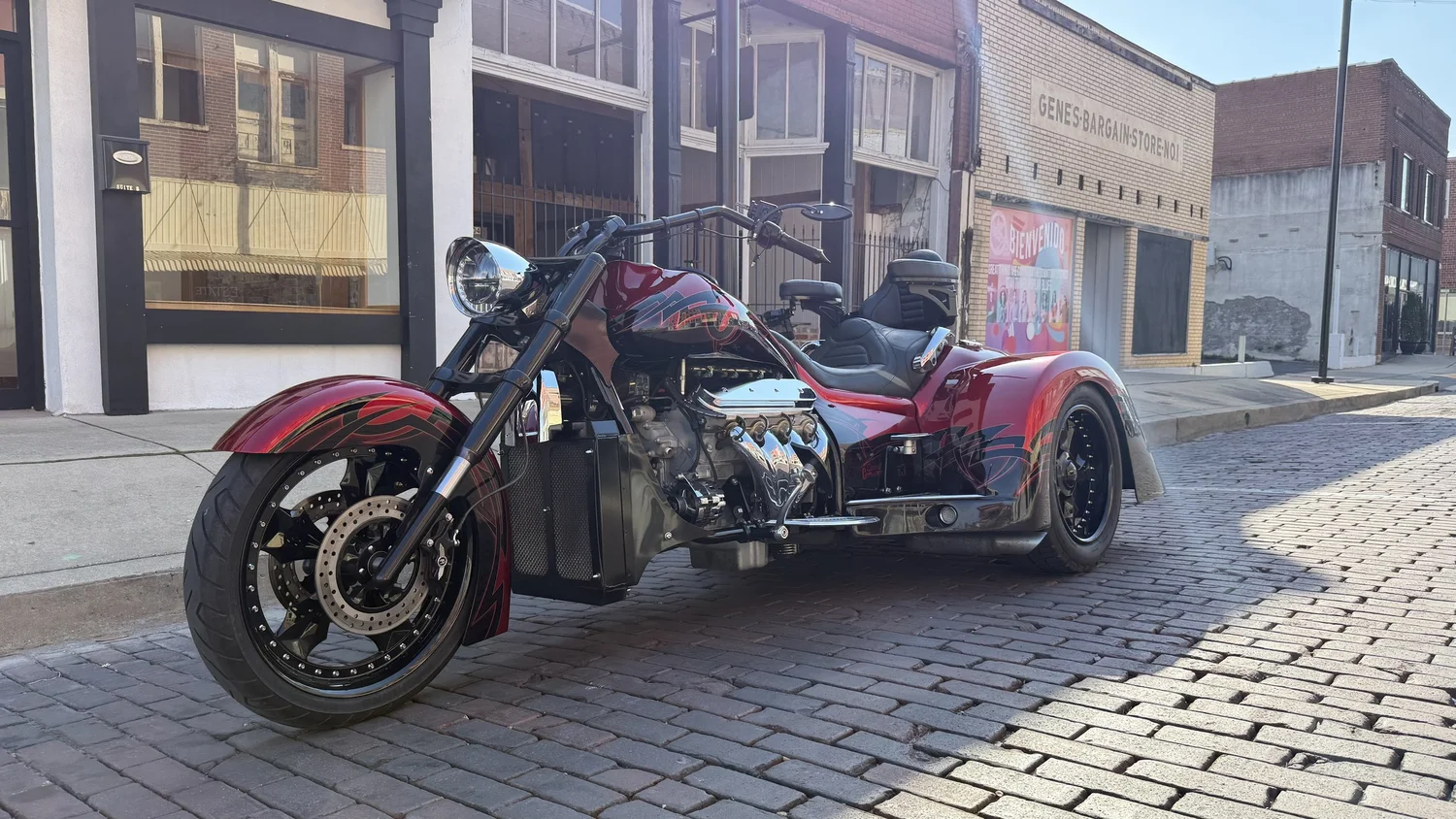 Red Challenger trike on a brick main street