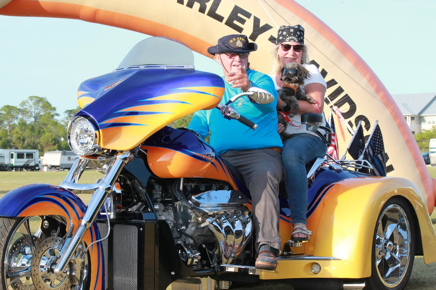 Couple riding two up on a Challenger trike