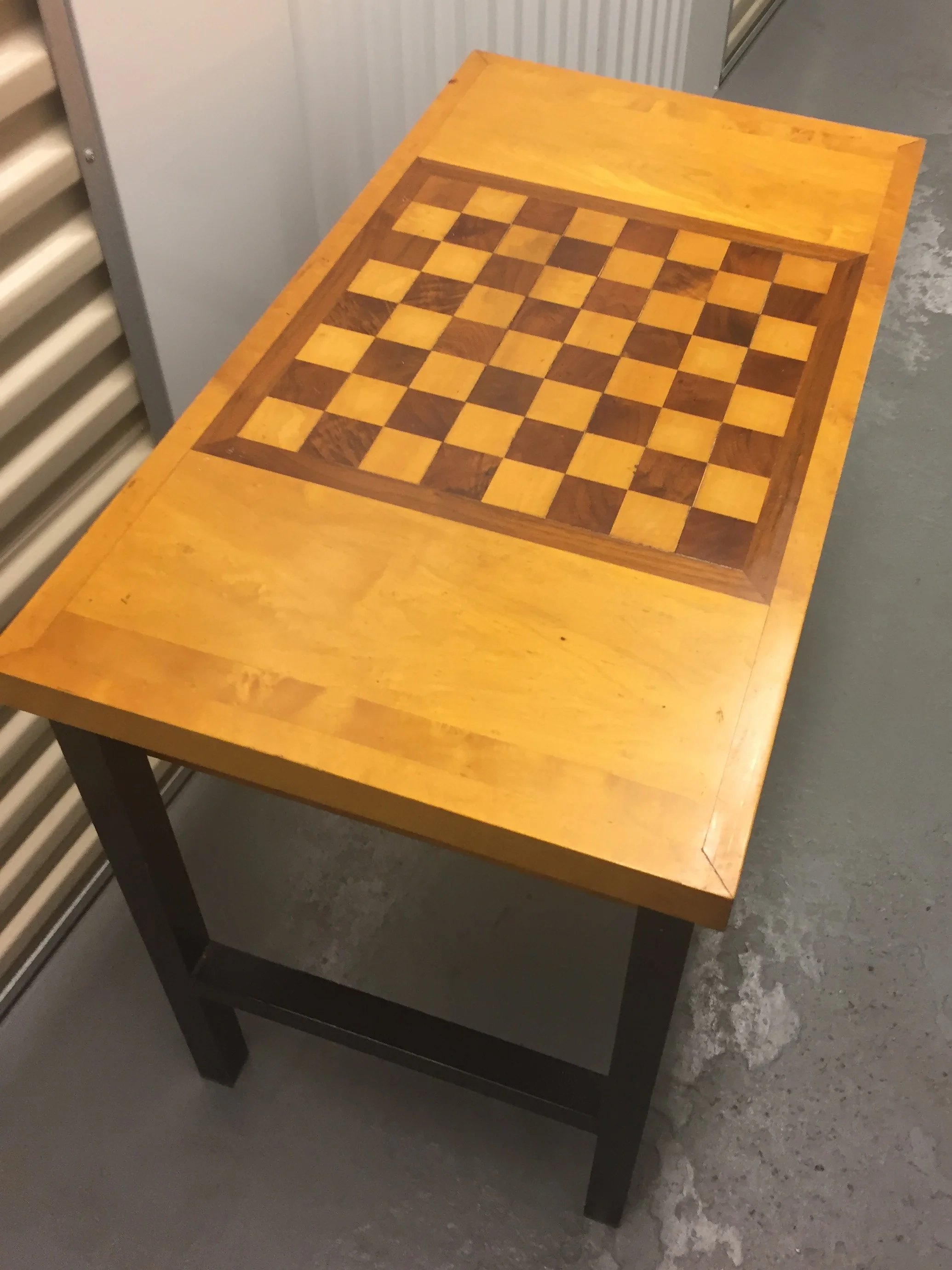 Inlaid squares, metal legs, drawers for pieces. Other than a tiny cigarette burn (the spot to the left of the corner at the top of the board), the table is in great shape!