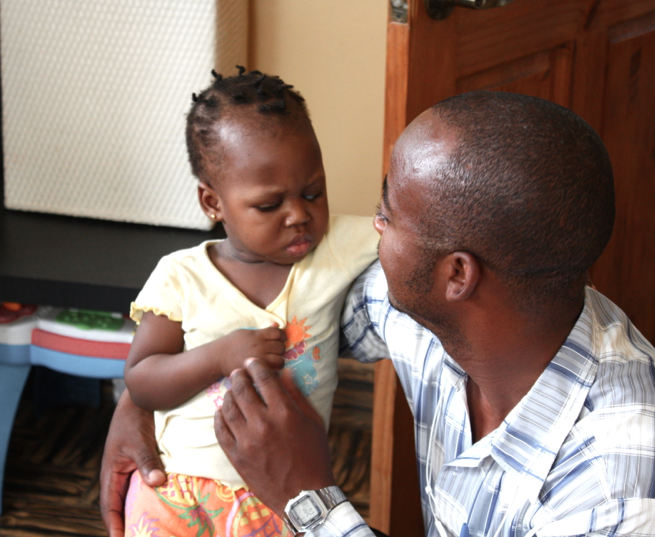 Alix, our orphanage director, comforts Ysmerline.