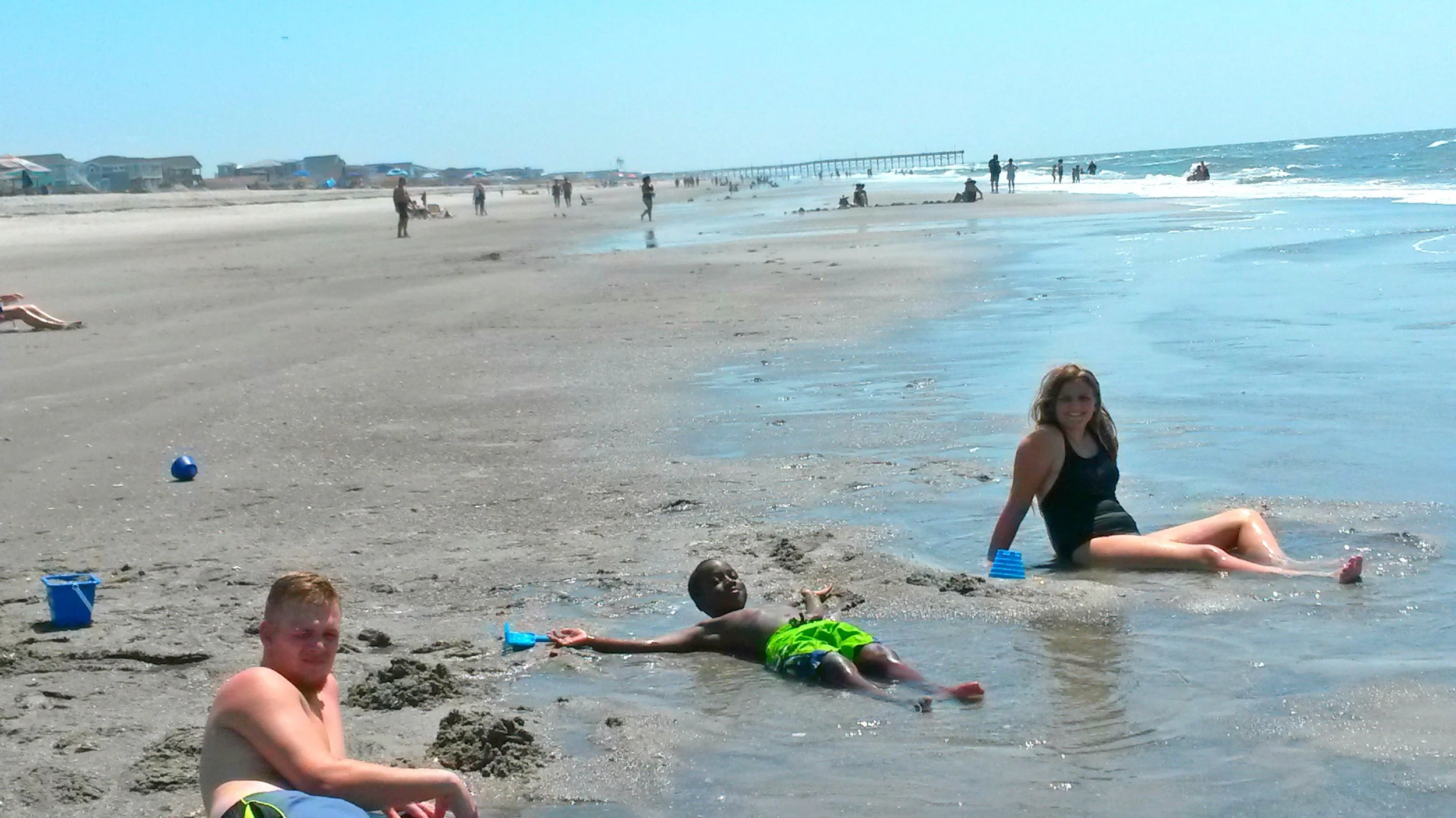 At the beach with his brother and sister