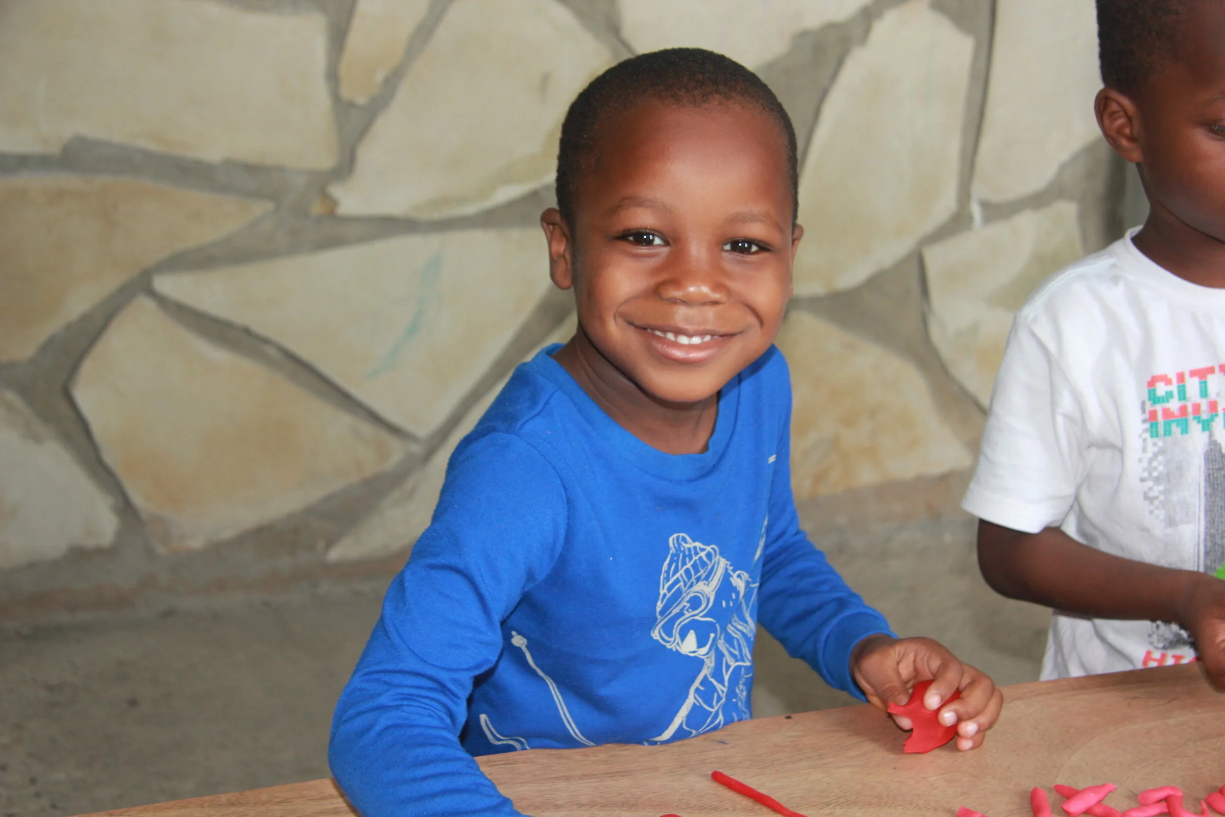  Steeve learning to write his name 